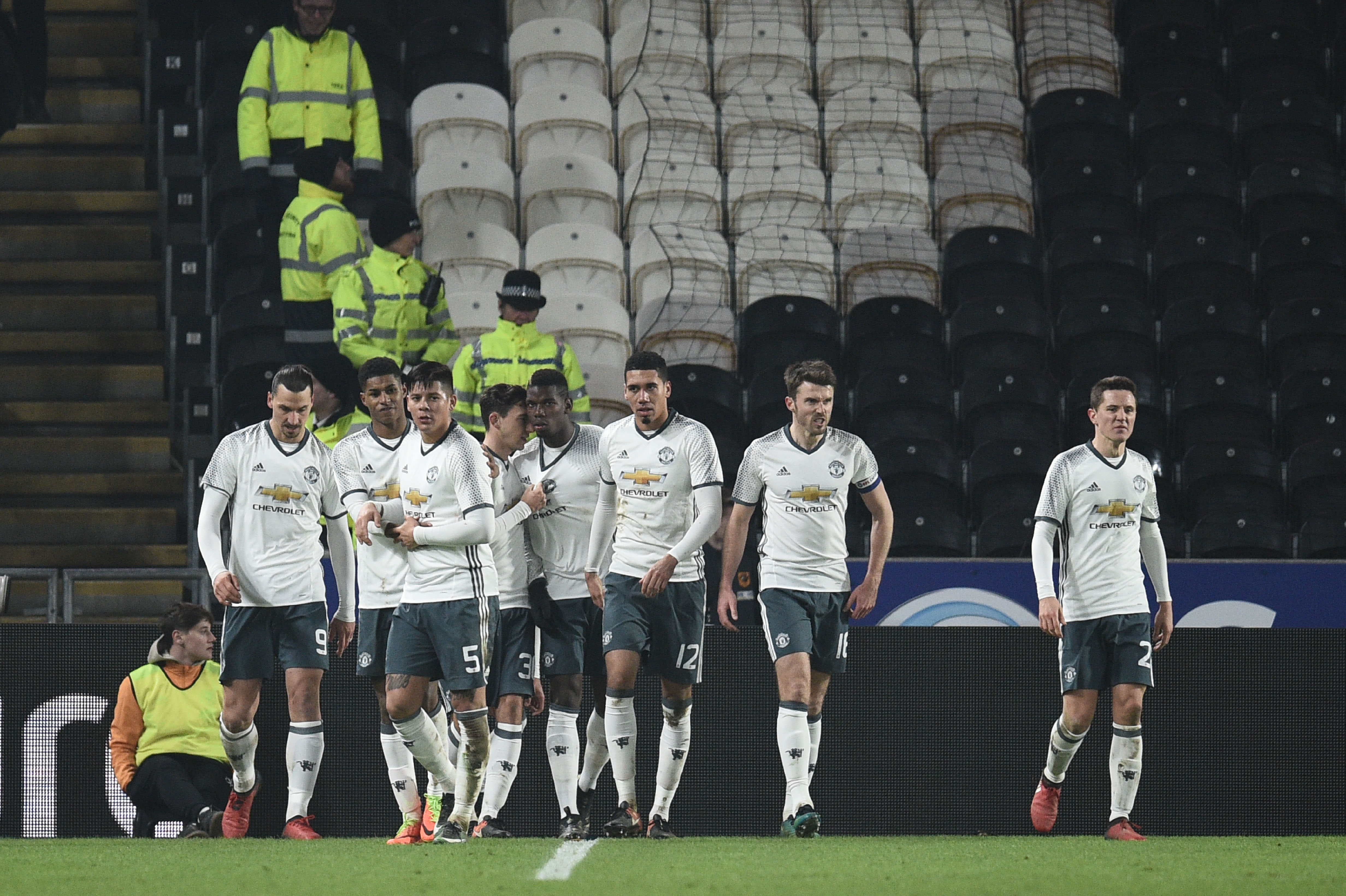 Manchester United's French midfielder Paul Pogba (C) celebrates with teammates afer scoring during the EFL (English Football League) Cup semi-final second-leg football match between Hull City and Manchester United at the KCOM Stadium in Kingston upon Hull, north east England on January 26, 2017.
  / AFP / Oli SCARFF / RESTRICTED TO EDITORIAL USE. No use with unauthorized audio, video, data, fixture lists, club/league logos or 'live' services. Online in-match use limited to 75 images, no video emulation. No use in betting, games or single club/league/player publications.  /         (Photo credit should read OLI SCARFF/AFP/Getty Images)