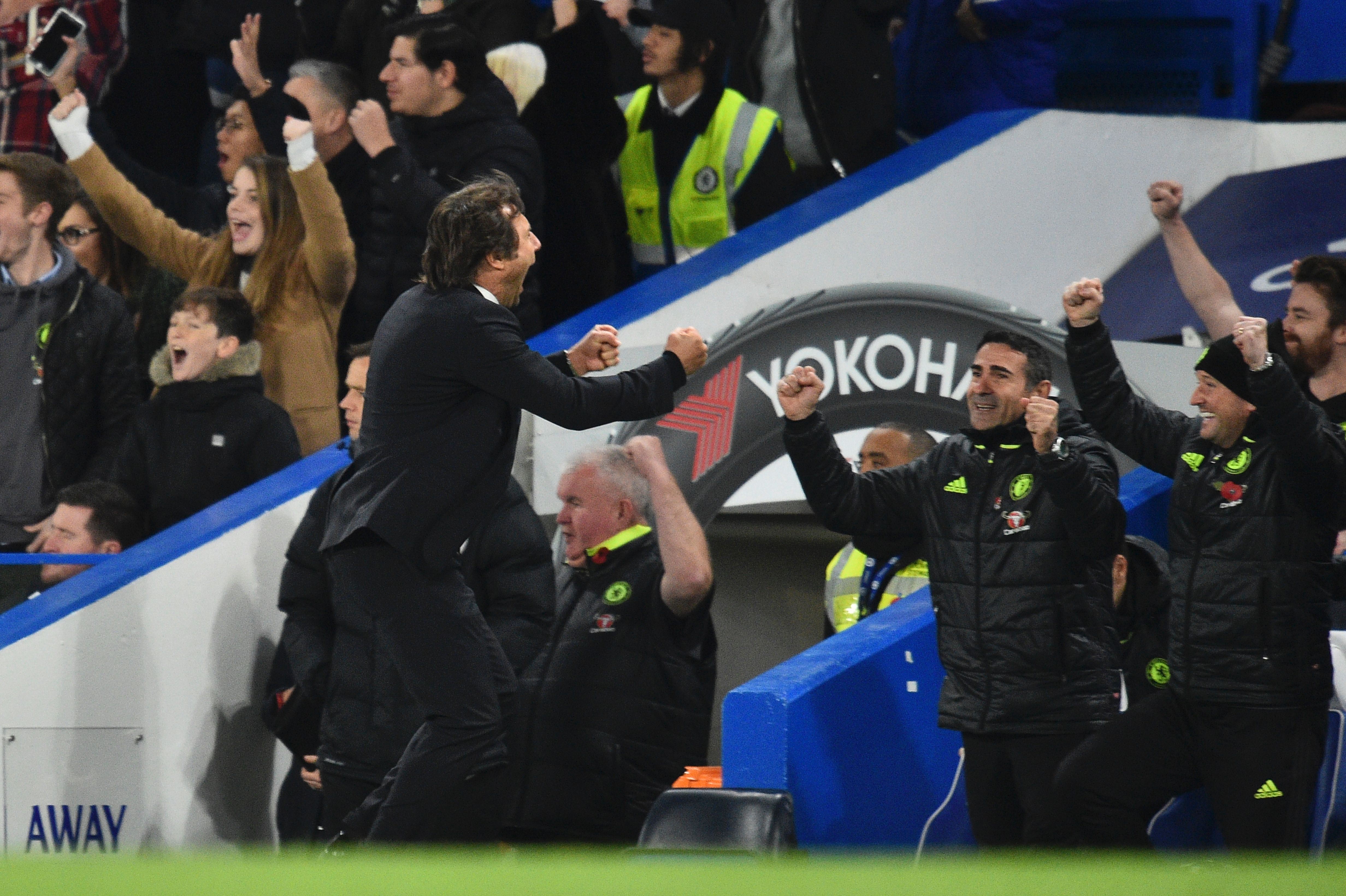 Chelsea's Italian head coach Antonio Conte celebrates as Hazard scores Chelsea's fourth goal during the English Premier League football match between Chelsea and Everton at Stamford Bridge in London on November 5, 2016. / AFP / Glyn KIRK / RESTRICTED TO EDITORIAL USE. No use with unauthorized audio, video, data, fixture lists, club/league logos or 'live' services. Online in-match use limited to 75 images, no video emulation. No use in betting, games or single club/league/player publications.  /         (Photo credit should read GLYN KIRK/AFP/Getty Images)