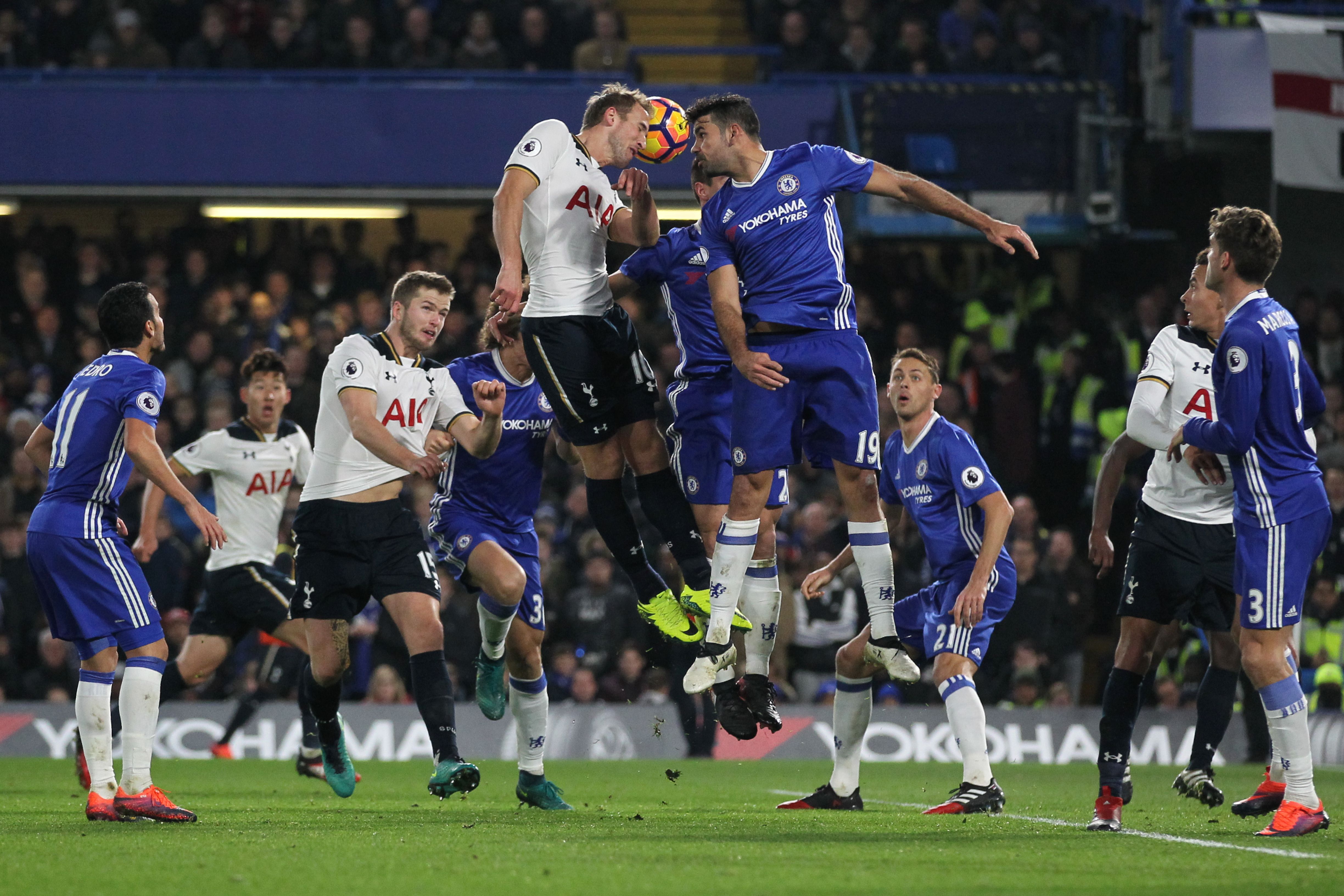 Tottenham Hotspur's English striker Harry Kane (CL) and Chelsea's Brazilian-born Spanish striker Diego Costa (CR) go up for a header during the English Premier League football match between Chelsea and Tottenham Hotspur at Stamford Bridge in London on November 26, 2016. (Photo by Ian Kington/AFP/Getty Images)