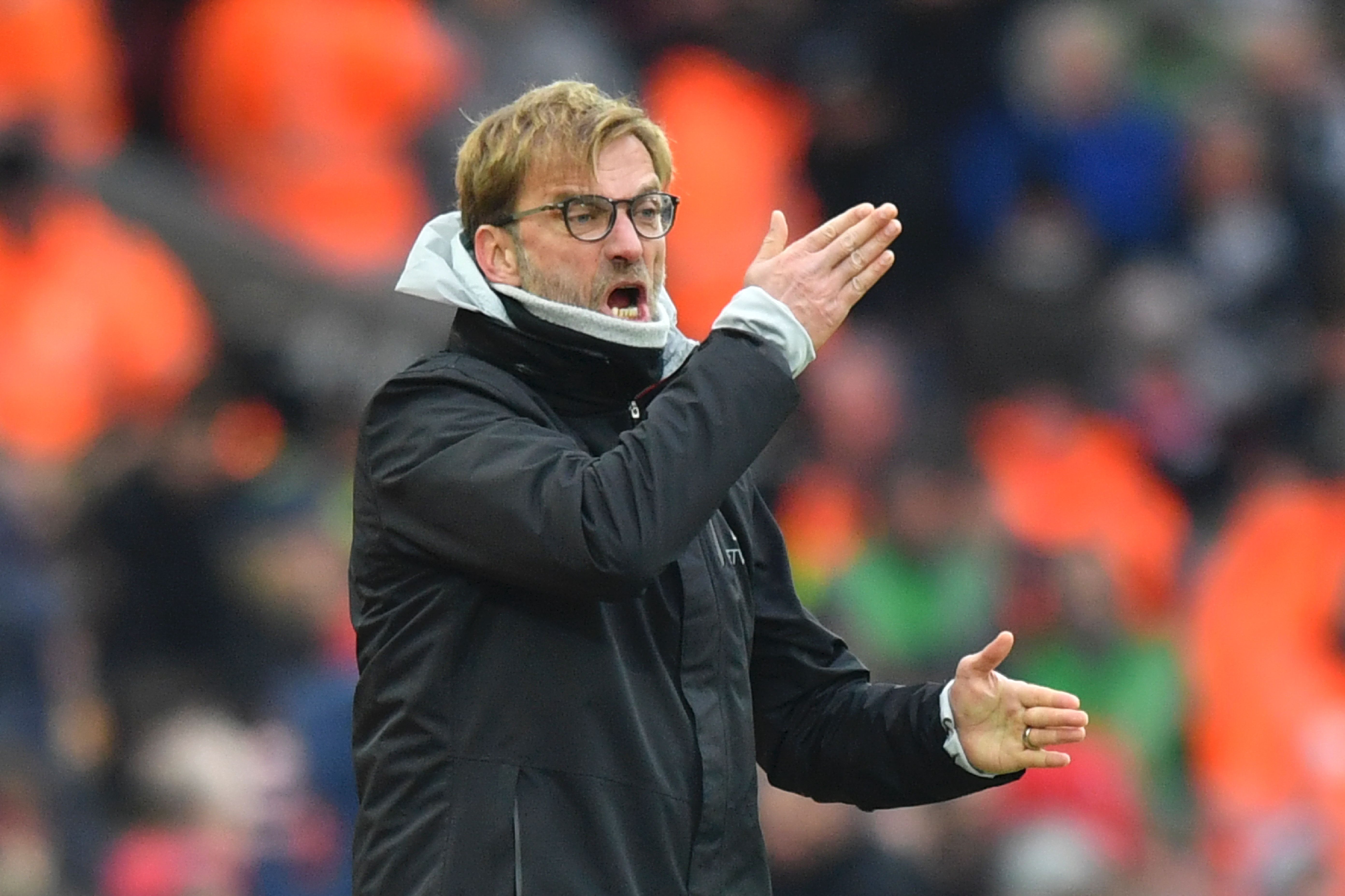 Liverpool's German manager Jurgen Klopp gestures on the touchline during the English Premier League football match between Liverpool and Swansea City at Anfield in Liverpool, north west England on January 21, 2017. / AFP / Anthony DEVLIN / RESTRICTED TO EDITORIAL USE. No use with unauthorized audio, video, data, fixture lists, club/league logos or 'live' services. Online in-match use limited to 75 images, no video emulation. No use in betting, games or single club/league/player publications.  /         (Photo credit should read ANTHONY DEVLIN/AFP/Getty Images)