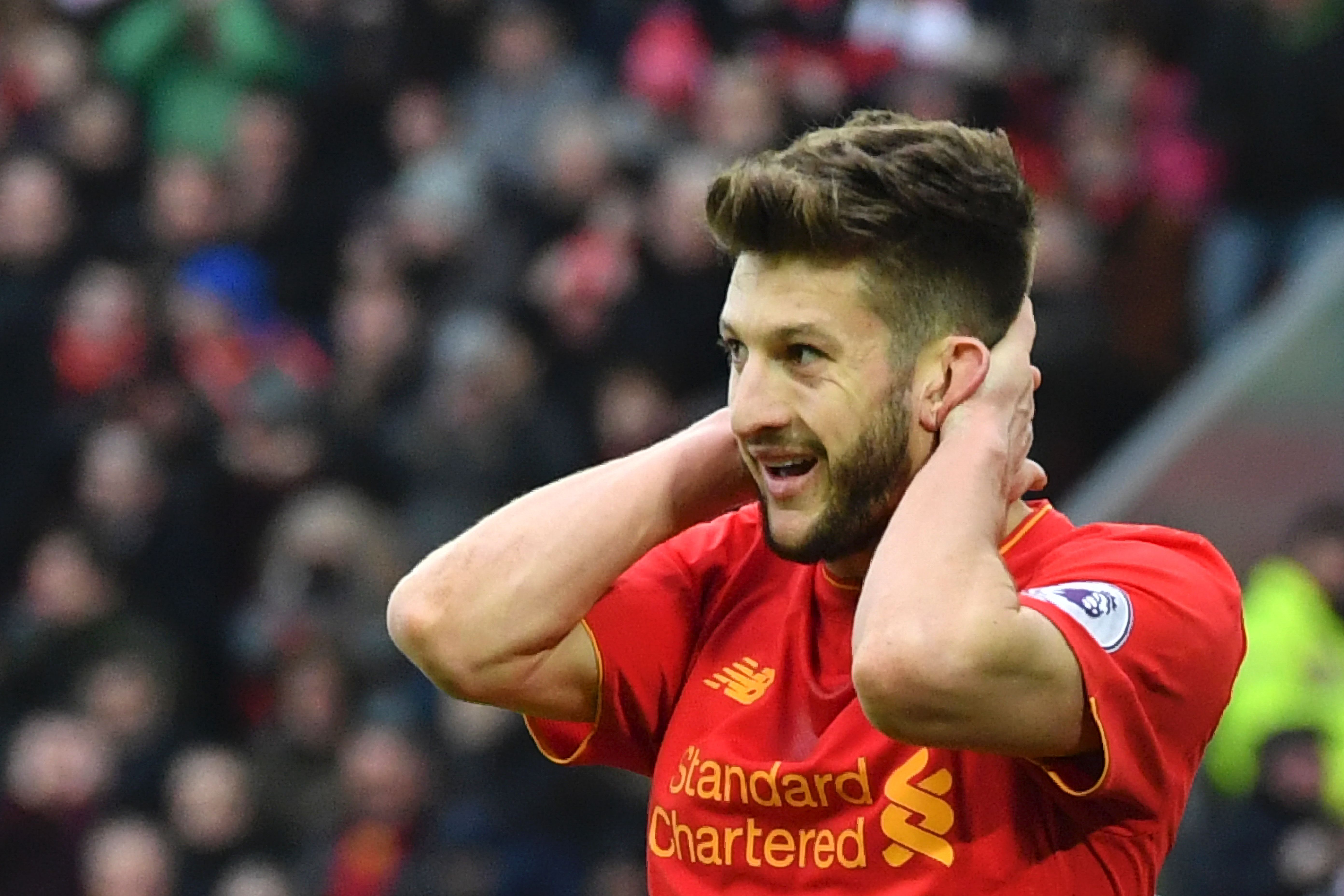 Liverpool's English midfielder Adam Lallana reacts after a missed chance during the English Premier League football match between Liverpool and Swansea City at Anfield in Liverpool, north west England on January 21, 2017. (Photo by Anthony Devlin/AFP/Getty Images)