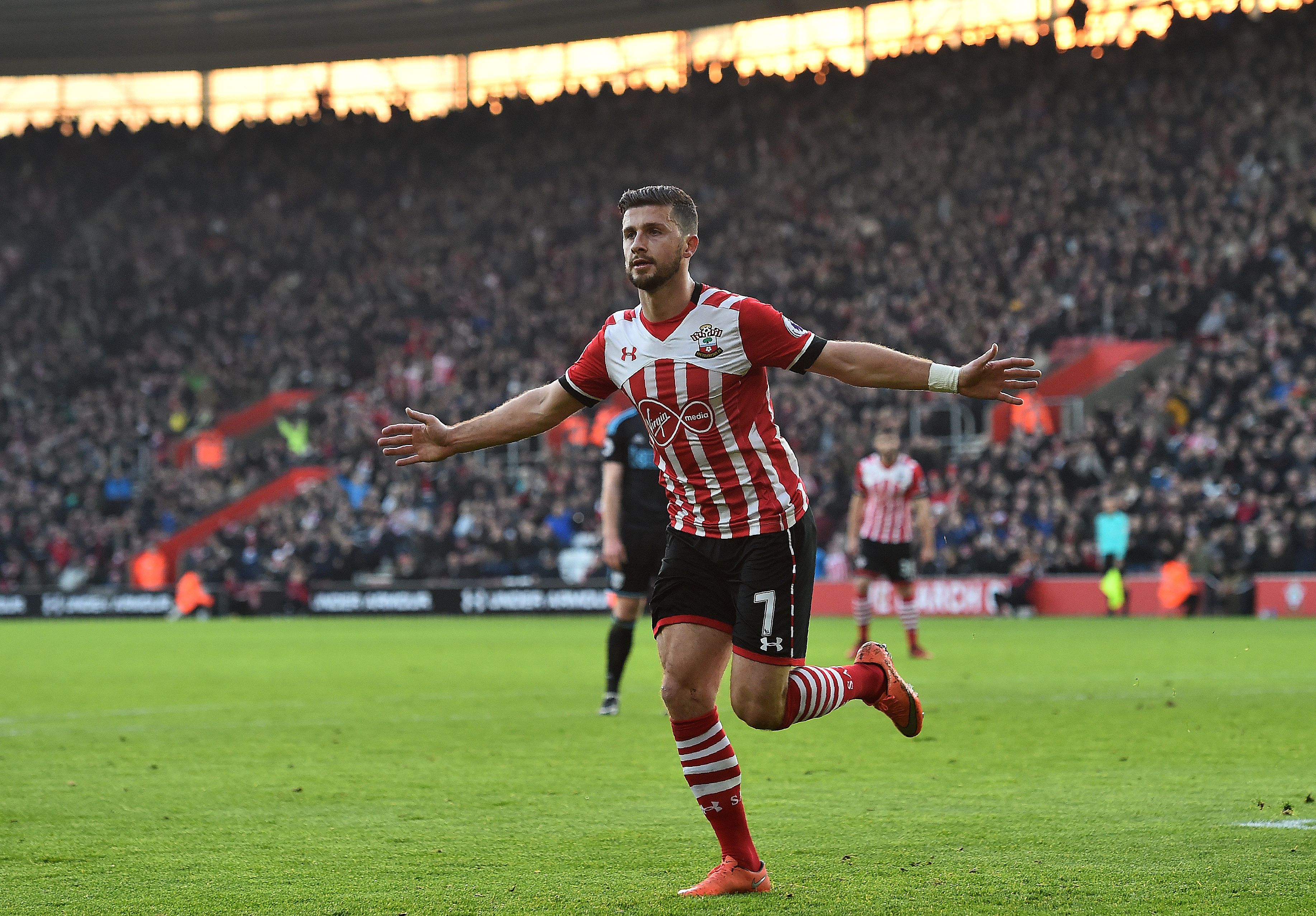 Southampton's Irish striker Shane Long celebrates scoring his team's first goal during the English Premier League football match between Southampton and West Bromwich Albion at St Mary's Stadium in Southampton, southern England on December 31, 2016. / AFP / Glyn KIRK / RESTRICTED TO EDITORIAL USE. No use with unauthorized audio, video, data, fixture lists, club/league logos or 'live' services. Online in-match use limited to 75 images, no video emulation. No use in betting, games or single club/league/player publications.  /         (Photo credit should read GLYN KIRK/AFP/Getty Images)