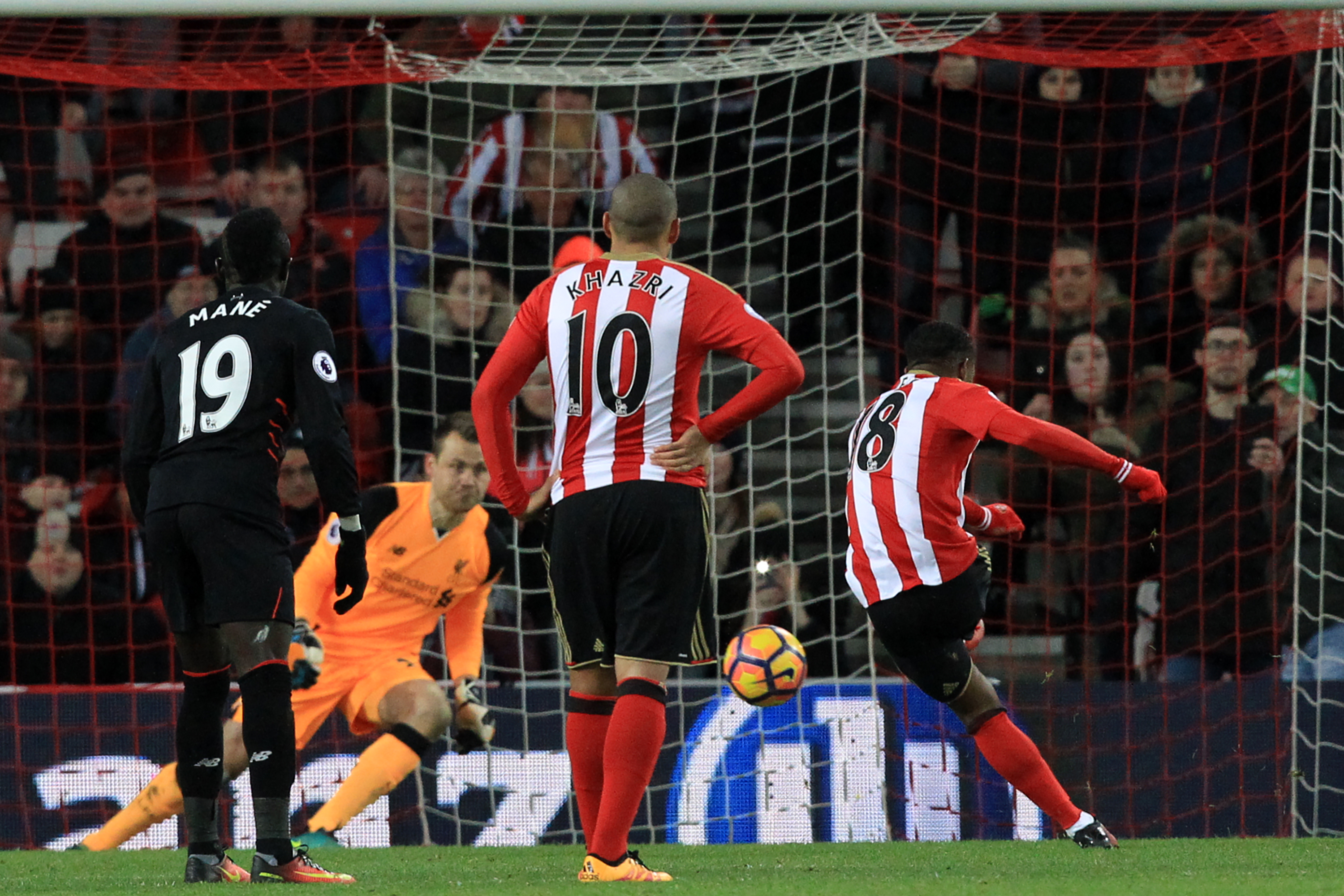 Sunderland's English striker Jermain Defoe (R) scores their second goal from the penalty spot during the English Premier League football match between Sunderland and Liverpool at the Stadium of Light in Sunderland, north-east England on January 2, 2017. / AFP / Lindsey PARNABY / RESTRICTED TO EDITORIAL USE. No use with unauthorized audio, video, data, fixture lists, club/league logos or 'live' services. Online in-match use limited to 75 images, no video emulation. No use in betting, games or single club/league/player publications.  /         (Photo credit should read LINDSEY PARNABY/AFP/Getty Images)