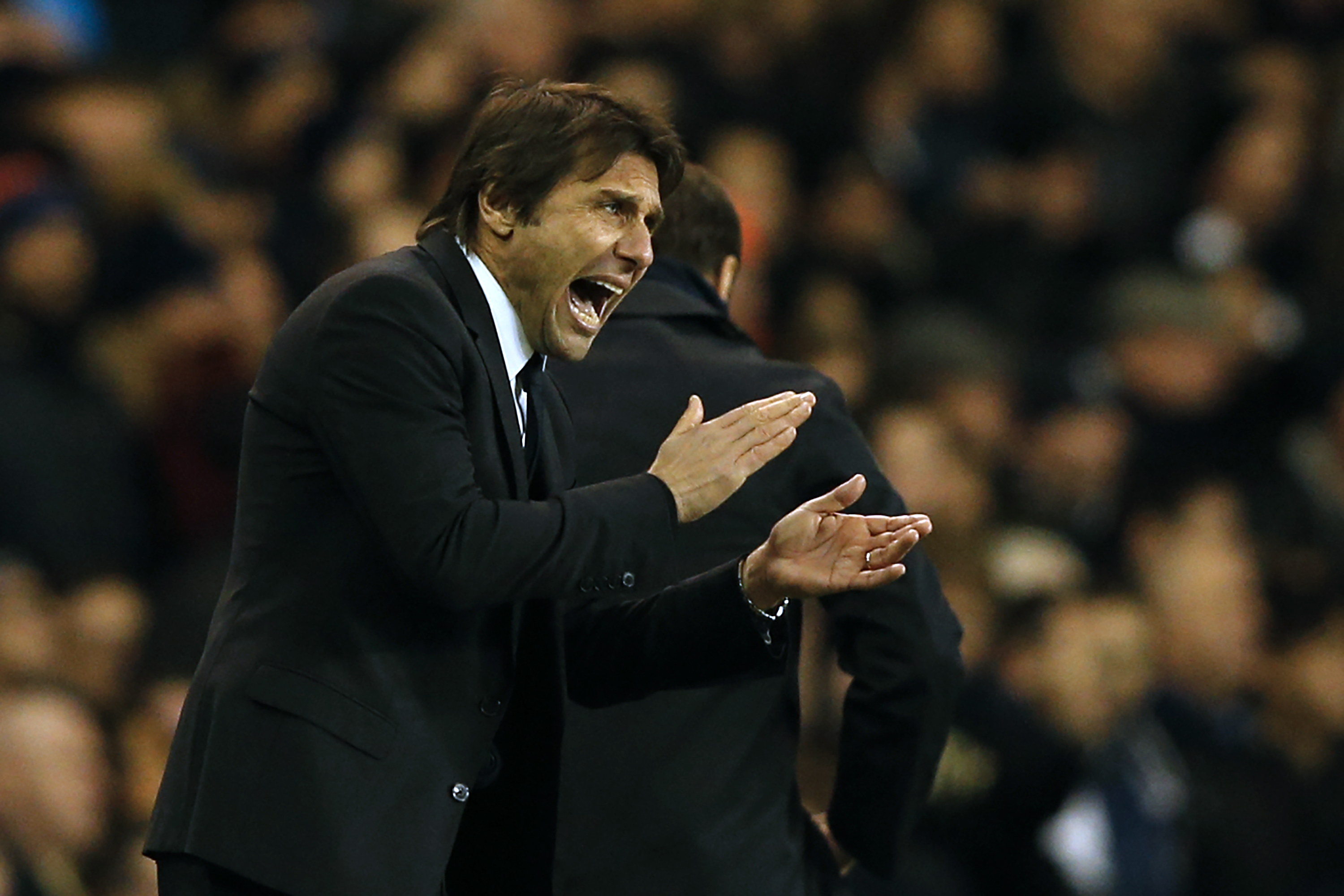 Chelsea's Italian head coach Antonio Conte gestures on the touchline during the English Premier League football match between Tottenham Hotspur and Chelsea at White Hart Lane in London, on January 4, 2017.
In-form midfielder Dele Alli scored two near-identical headers as Tottenham Hotspur beat Chelsea 2-0 on Wednesday to torpedo the Premier League leaders' hopes of a record 14th consecutive victory. (Photo by Adrian Dennis/AFP/Getty Images)