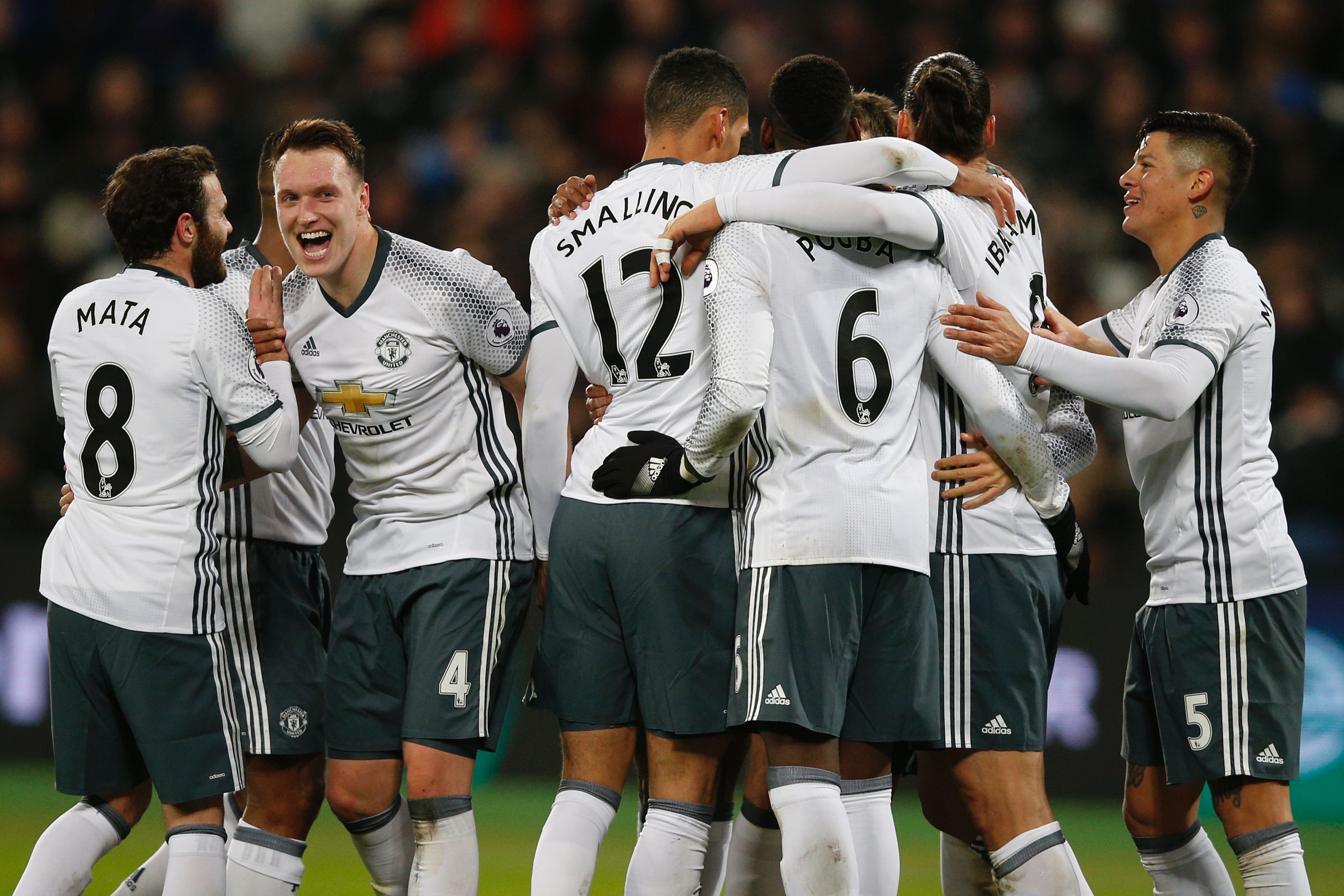 Manchester United's Swedish striker Zlatan Ibrahimovic (2nd R) celebrates with teammates after scoring their second goal during the English Premier League football match between West Ham United and Manchester United at The London Stadium, in east London on January 2, 2017.
Manchester United won the game 2-0. (Photo by Adrian Dennis/AFP/Getty Images)