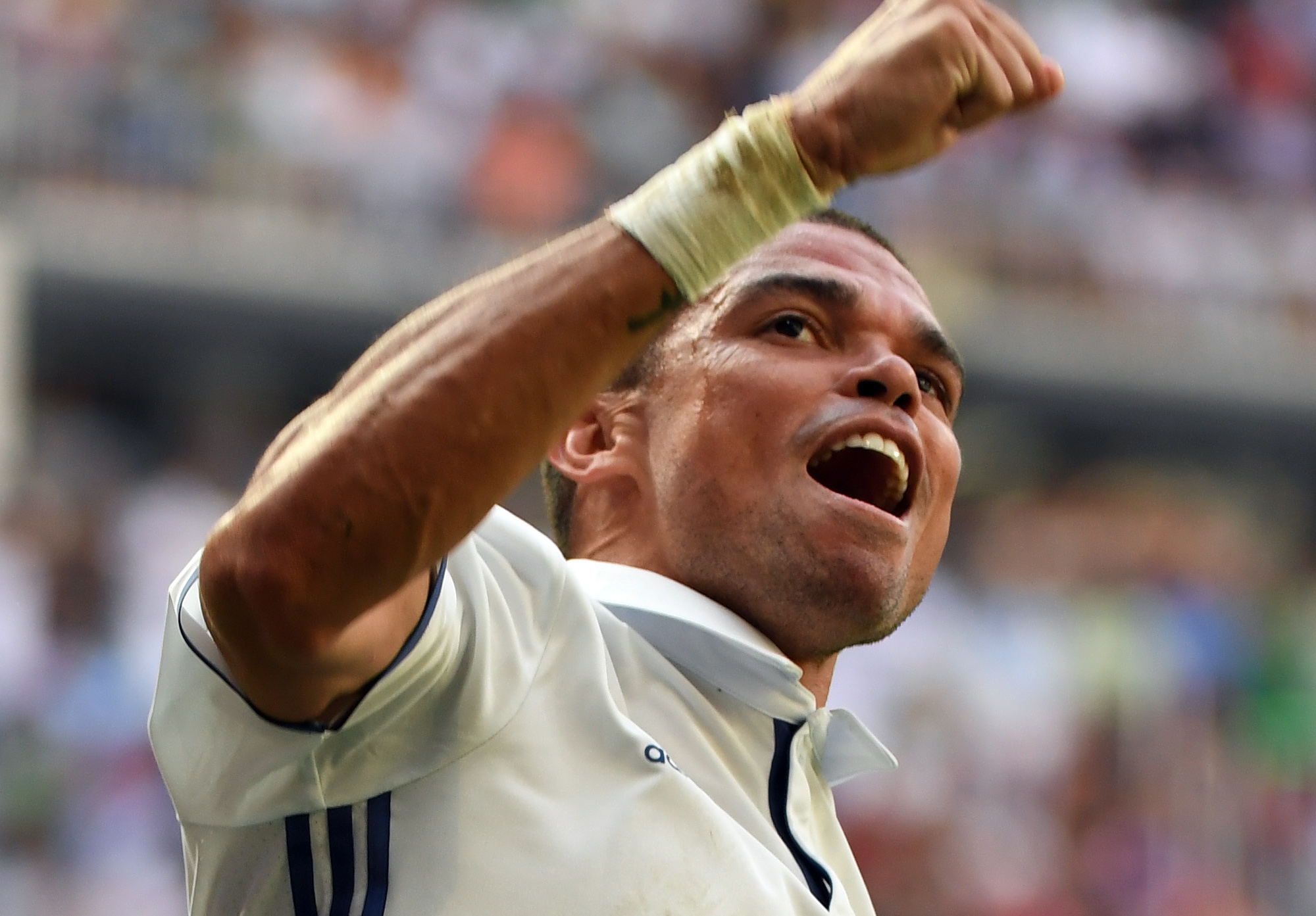 Real Madrid's Portuguese defender Pepe celebrates after scoring during the Spanish league football match Real Madrid CF vs CA Osasuna at the Santiago Bernabeu stadium in Madrid on September 10, 2016. / AFP / GERARD JULIEN        (Photo credit should read GERARD JULIEN/AFP/Getty Images)