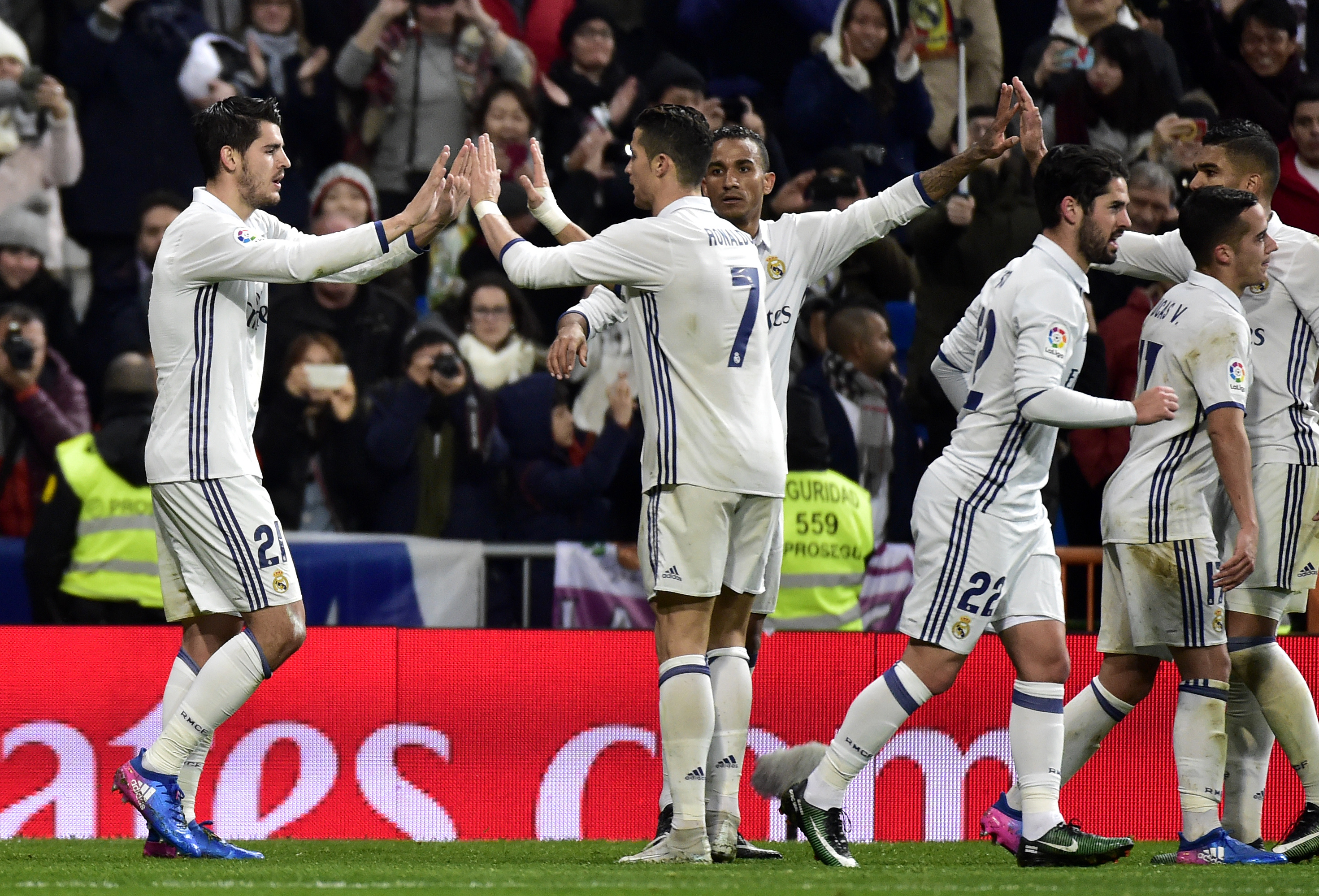 Real Madrid's forward Alvaro Morata is congratuled by Real Madrid's Portuguese forward Cristiano Ronaldo (2L) after scoring a goal during the Spanish league football match Real Madrid CF vs Real Sociedad at the Santiago Bernabeu stadium in Madrid on January 29, 2017. / AFP / GERARD JULIEN        (Photo credit should read GERARD JULIEN/AFP/Getty Images)