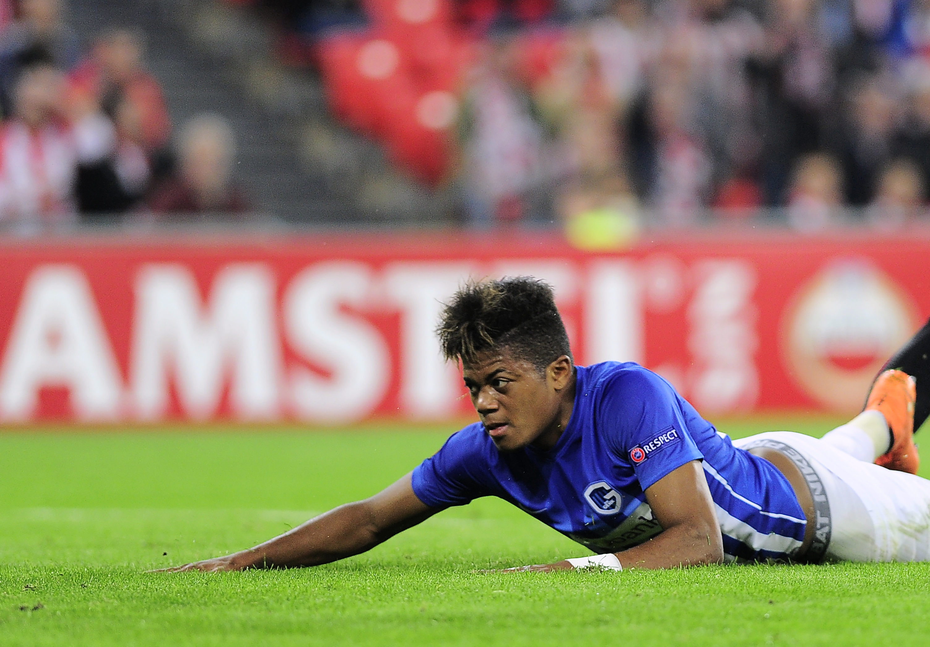 Genk's Jamaican midfielder Leon Bailey lies on the pitch just after scoring during the Europa League Group F football match Athletic Club de Bilbao vs KRC Genk at the San Mames stadium in Bilbao on November 3, 2016. (Photo by Ander Gillenea/AFP/Getty Images)