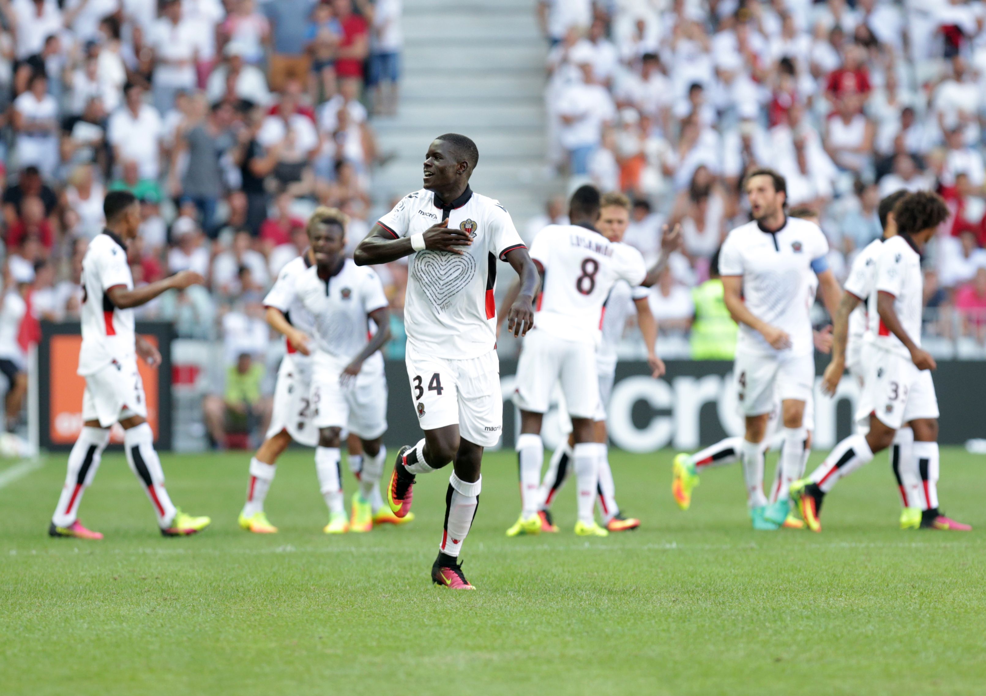 Nice's French defender Malang Sarr (C) celebrates after scoring a goal during the French L1 football match Nice versus Rennes on August 14, 2016, at the Allianz Riviera stadium in Nice, southeastern France.  / AFP / JEAN CHRISTOPHE MAGNENET        (Photo credit should read JEAN CHRISTOPHE MAGNENET/AFP/Getty Images)