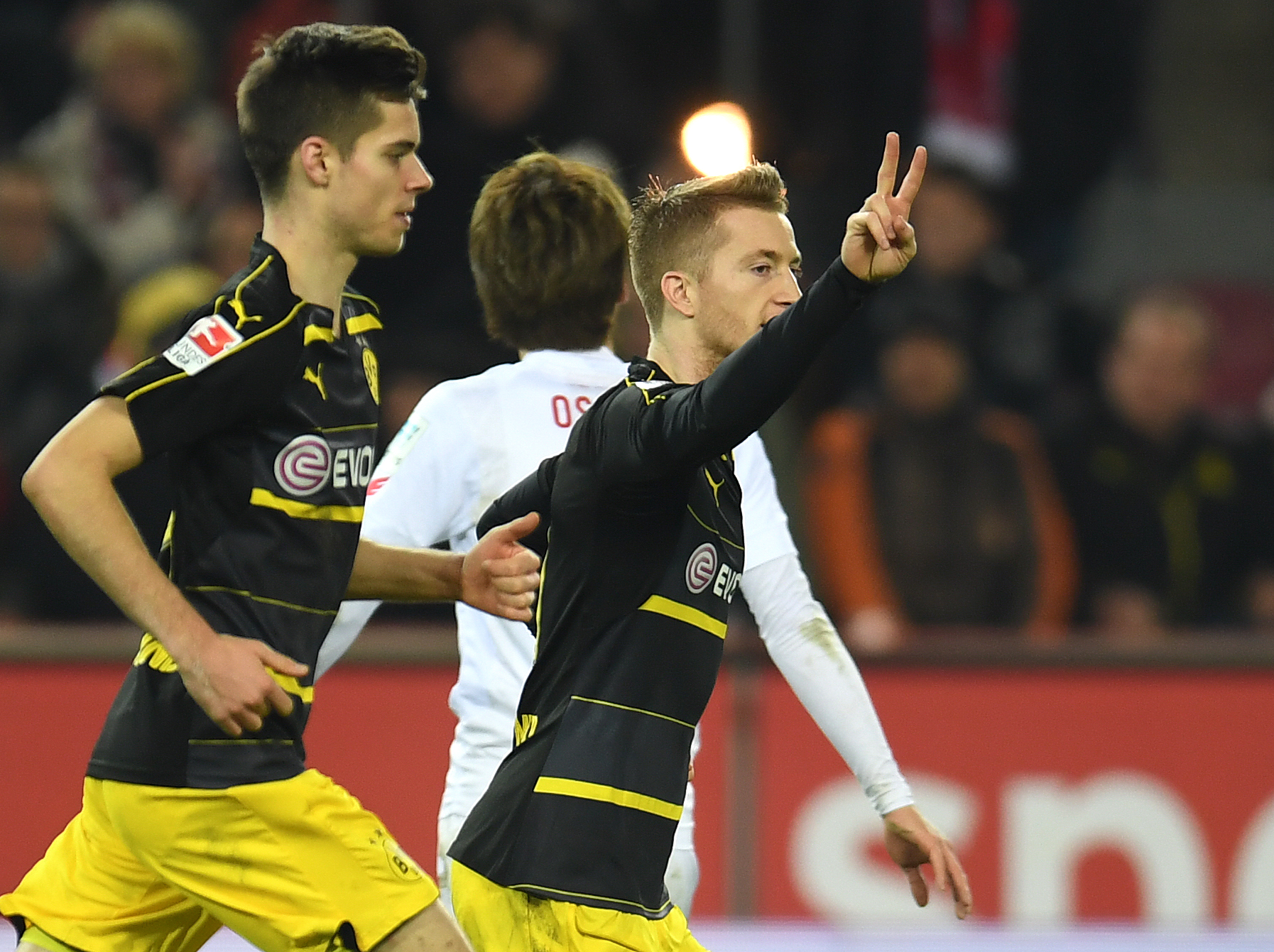 Dortmund's striker Marco Reus celebrates during the German first division Bundesliga football match between 1 FC Cologne and Borussia Dortmund in Cologne western Germany, on December 10, 2016.  / AFP / PATRIK STOLLARZ / RESTRICTIONS: DURING MATCH TIME: DFL RULES TO LIMIT THE ONLINE USAGE TO 15 PICTURES PER MATCH AND FORBID IMAGE SEQUENCES TO SIMULATE VIDEO. == RESTRICTED TO EDITORIAL USE == FOR FURTHER QUERIES PLEASE CONTACT DFL DIRECTLY AT + 49 69 650050
        (Photo credit should read PATRIK STOLLARZ/AFP/Getty Images)
