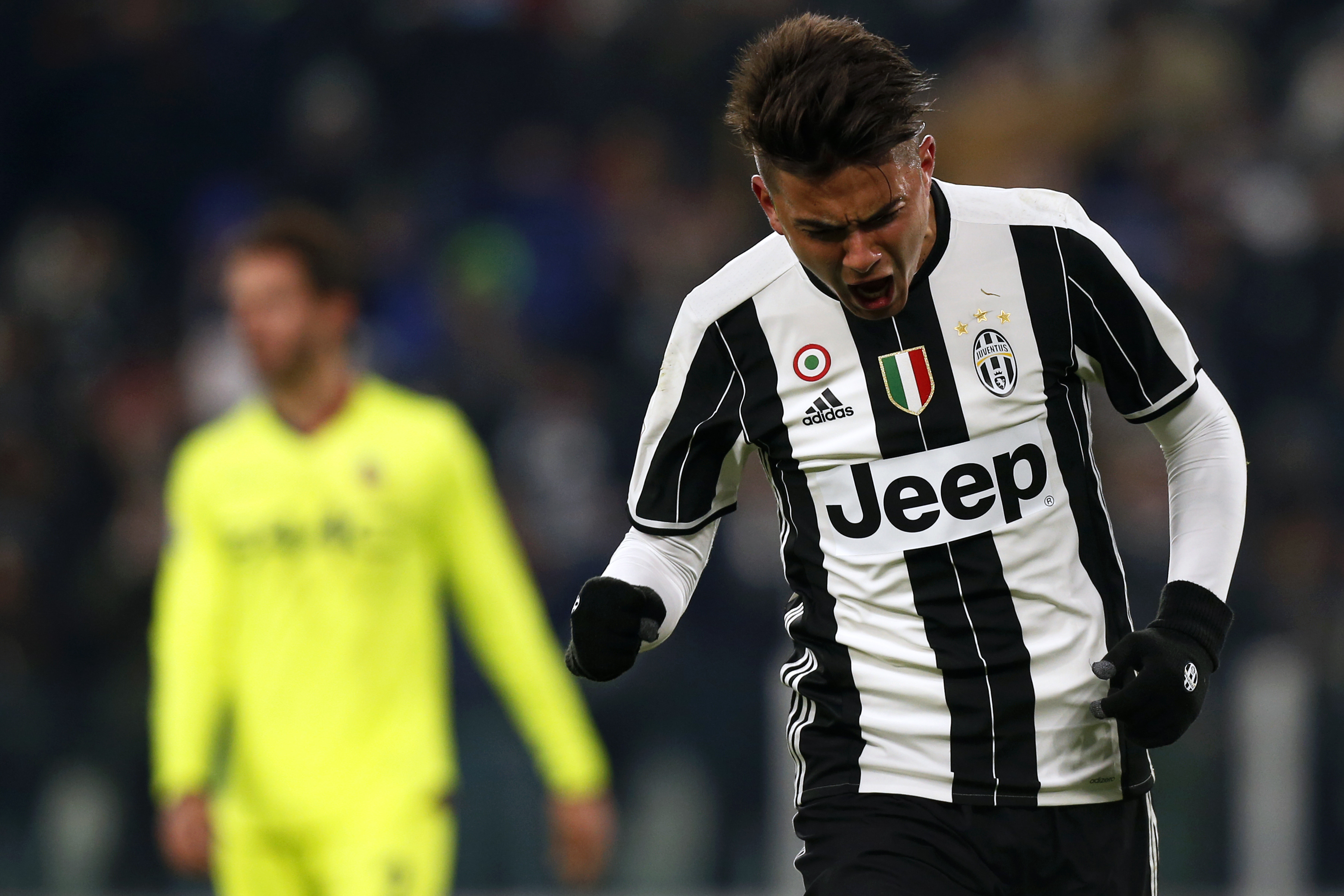 Juventus' forward Paulo Dybala from Argentina celebrates after scoring during the Italian Serie A football match Juventus Vs Bologna on January 8, 2017 at the 'Juventus Stadium' in Turin.   / AFP / MARCO BERTORELLO        (Photo credit should read MARCO BERTORELLO/AFP/Getty Images)