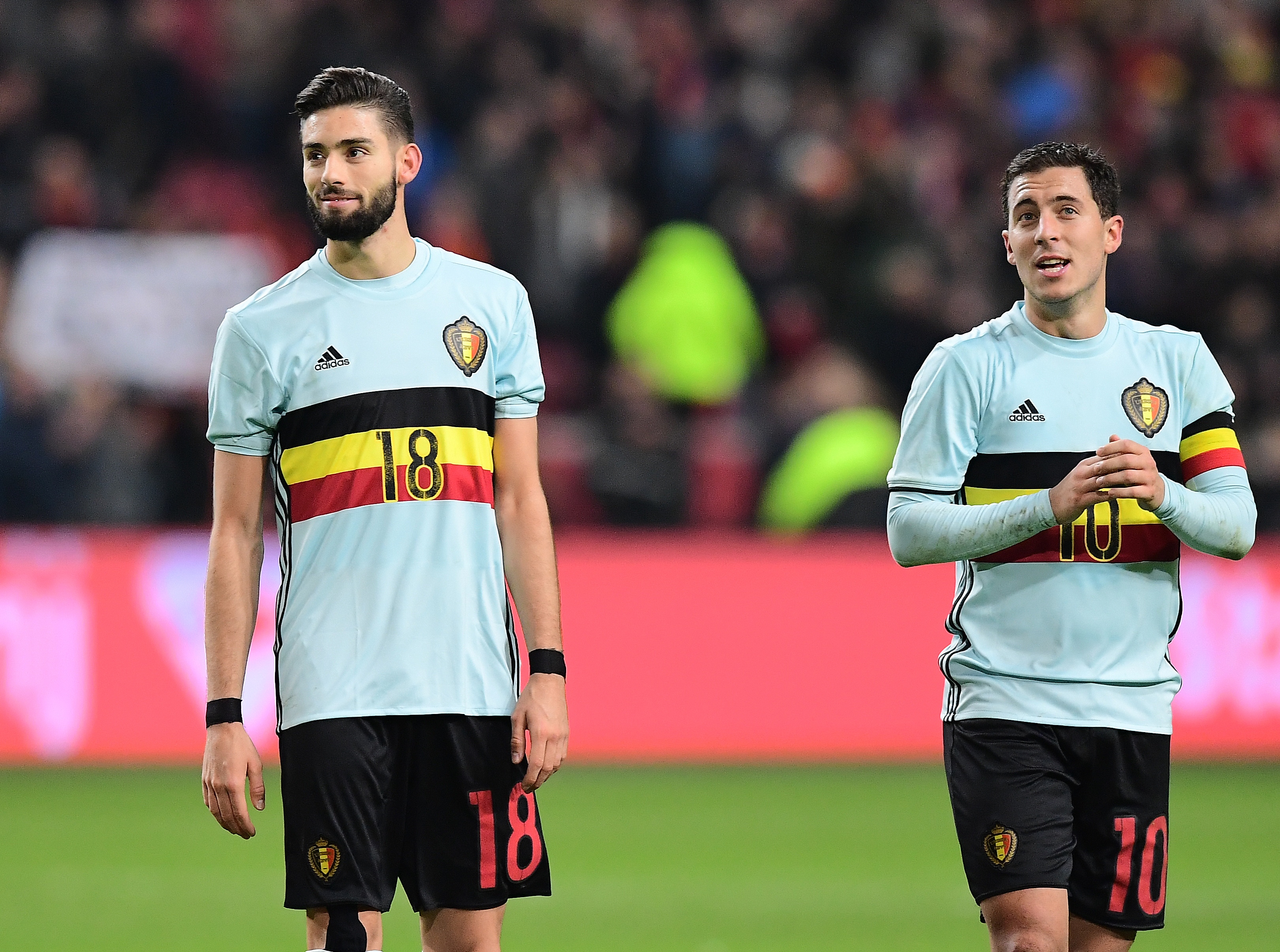 Belgium's forward Eden Hazard (R) and Belgium's midfielder Yannick Ferreira-Carrasco greet their supporters at the end of the friendly football match between The Netherlands and Belgium at the Amsterdam Arena in Amsterdam on November 9, 2016.    / AFP / EMMANUEL DUNAND        (Photo credit should read EMMANUEL DUNAND/AFP/Getty Images)