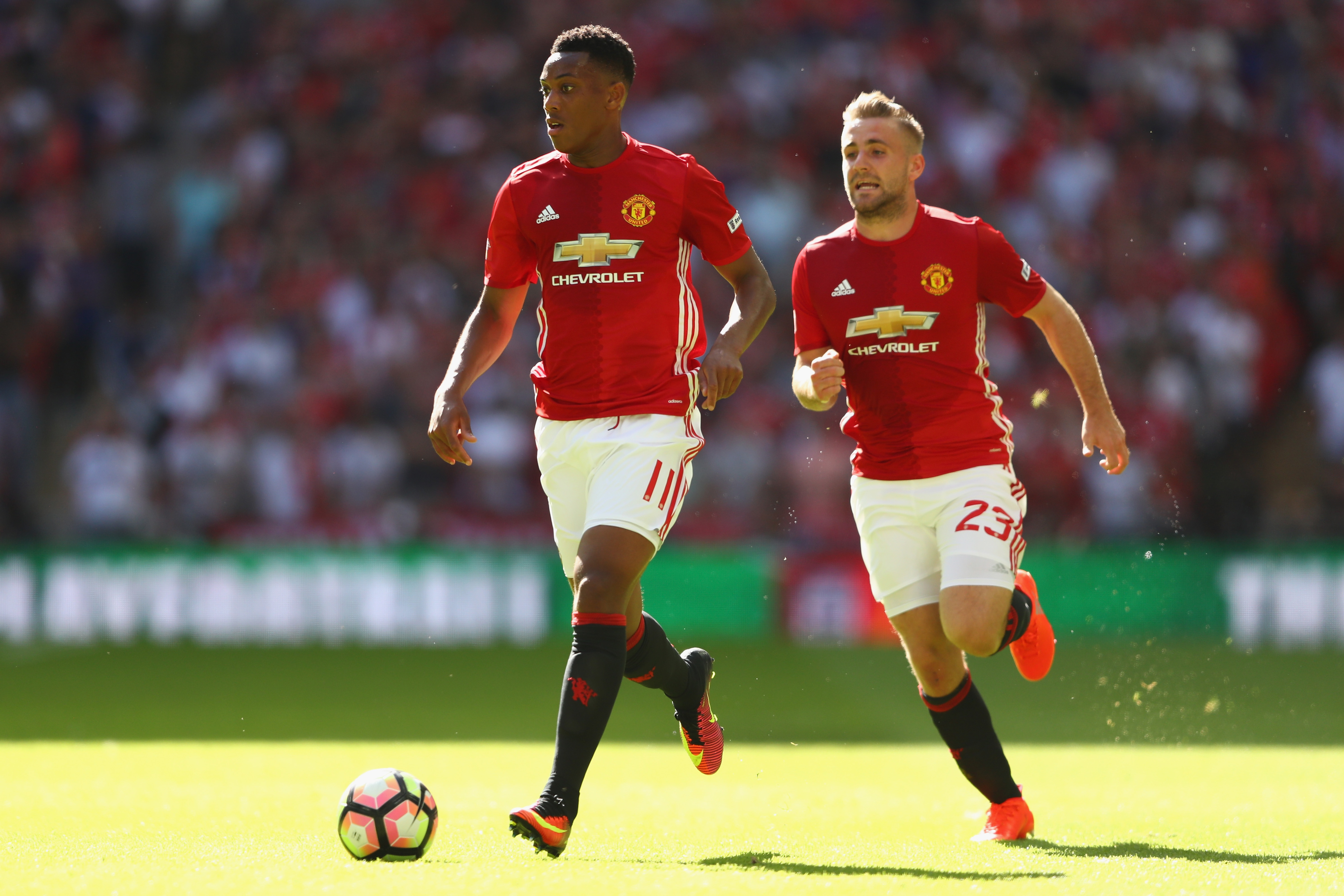 LONDON, ENGLAND - AUGUST 07:  Anthony Martial (L) and Luke Shaw (R)  of Manchester United during the Community Shield match between Leicester City and Manchester United at Wembley Stadium on August 7, 2016 in London, England.  (Photo by Michael Steele/Getty Images)