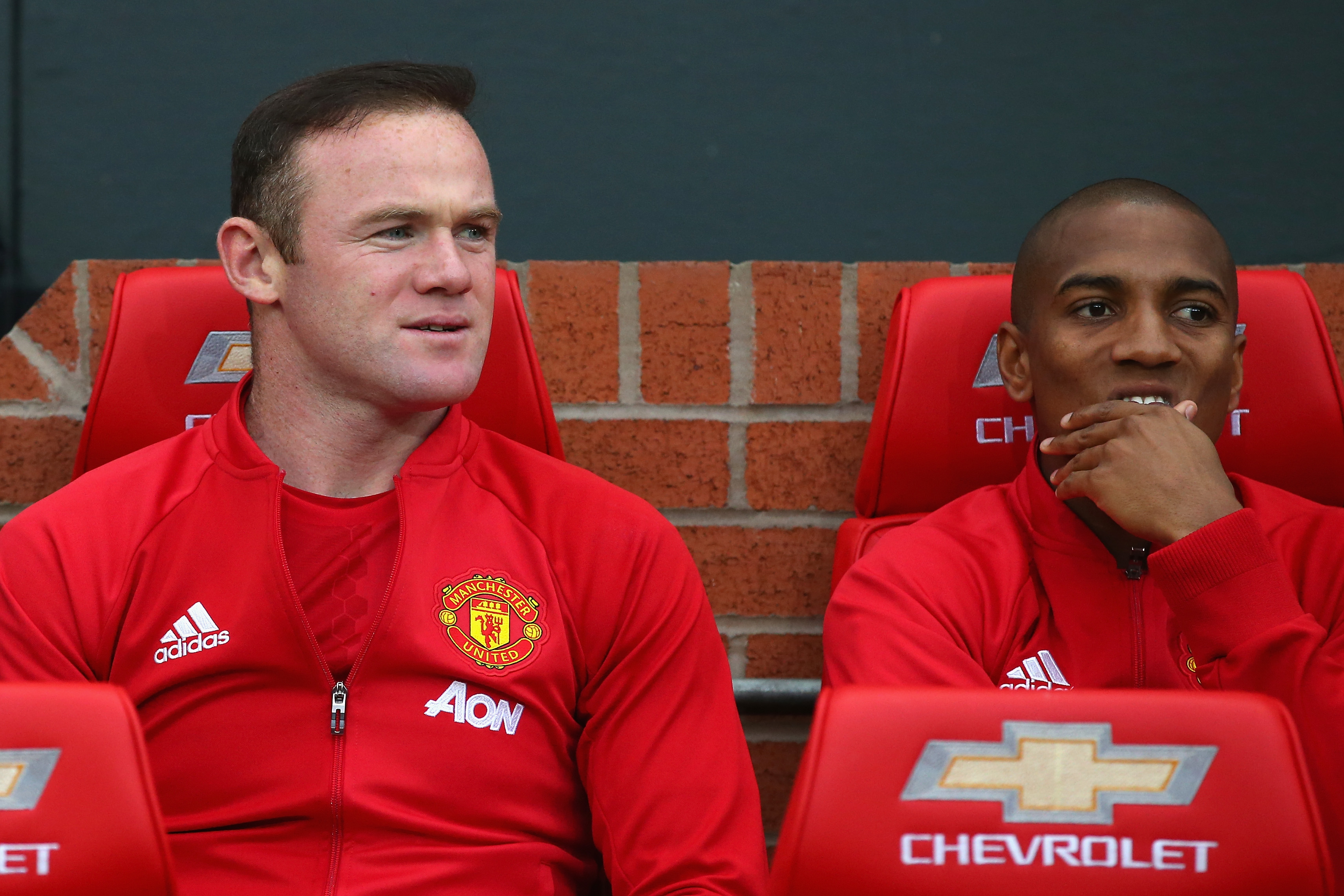 MANCHESTER, ENGLAND - OCTOBER 29: Wayne Rooney of Manchester United (L) takes his place on the bench with Ashley Young of Manchester United (R) during the Premier League match between Manchester United and Burnley at Old Trafford on October 29, 2016 in Manchester, England.  (Photo by Alex Livesey/Getty Images)