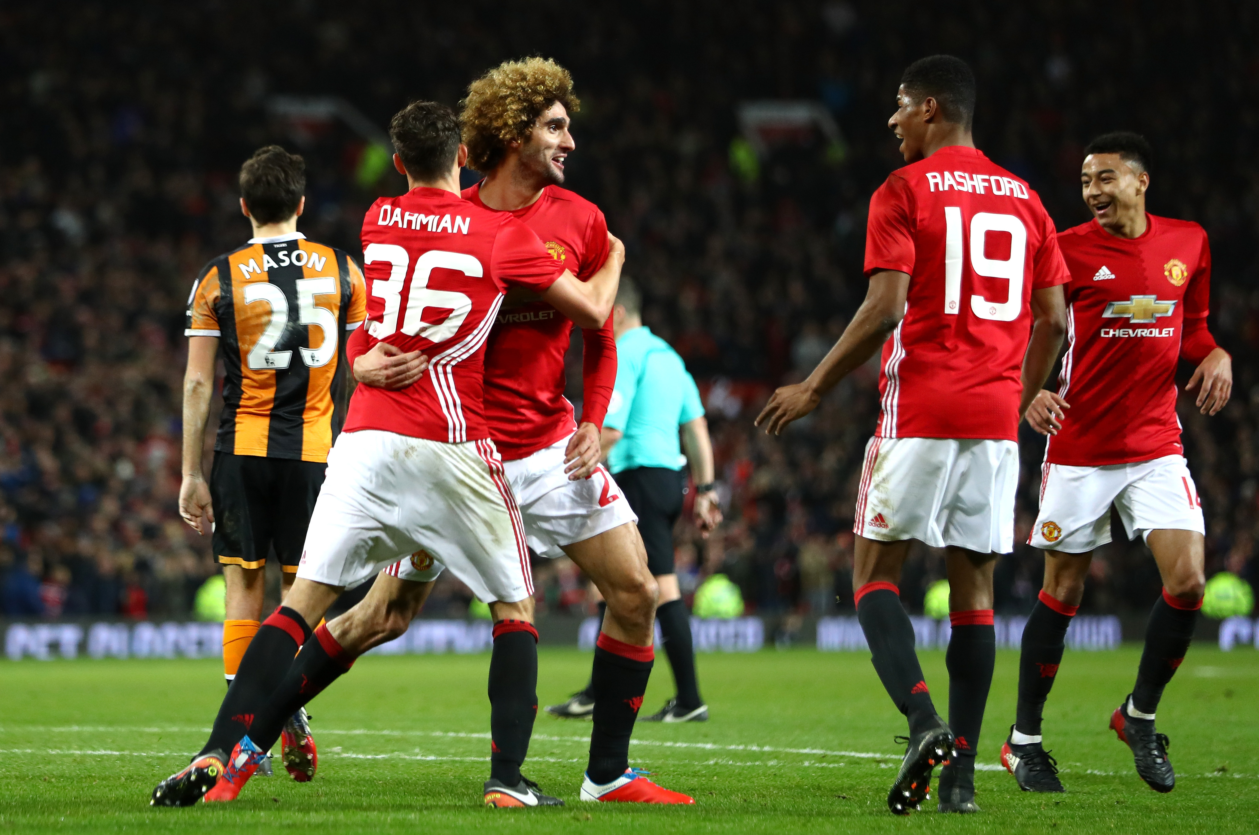 MANCHESTER, ENGLAND - JANUARY 10:  Marouane Fellaini of Manchester United celebrates with team mates after scoring his sides second goal his sides second goal during the EFL Cup Semi-Final First Leg match between Manchester United and Hull City at Old Trafford on January 10, 2017 in Manchester, England.  (Photo by Clive Mason/Getty Images)