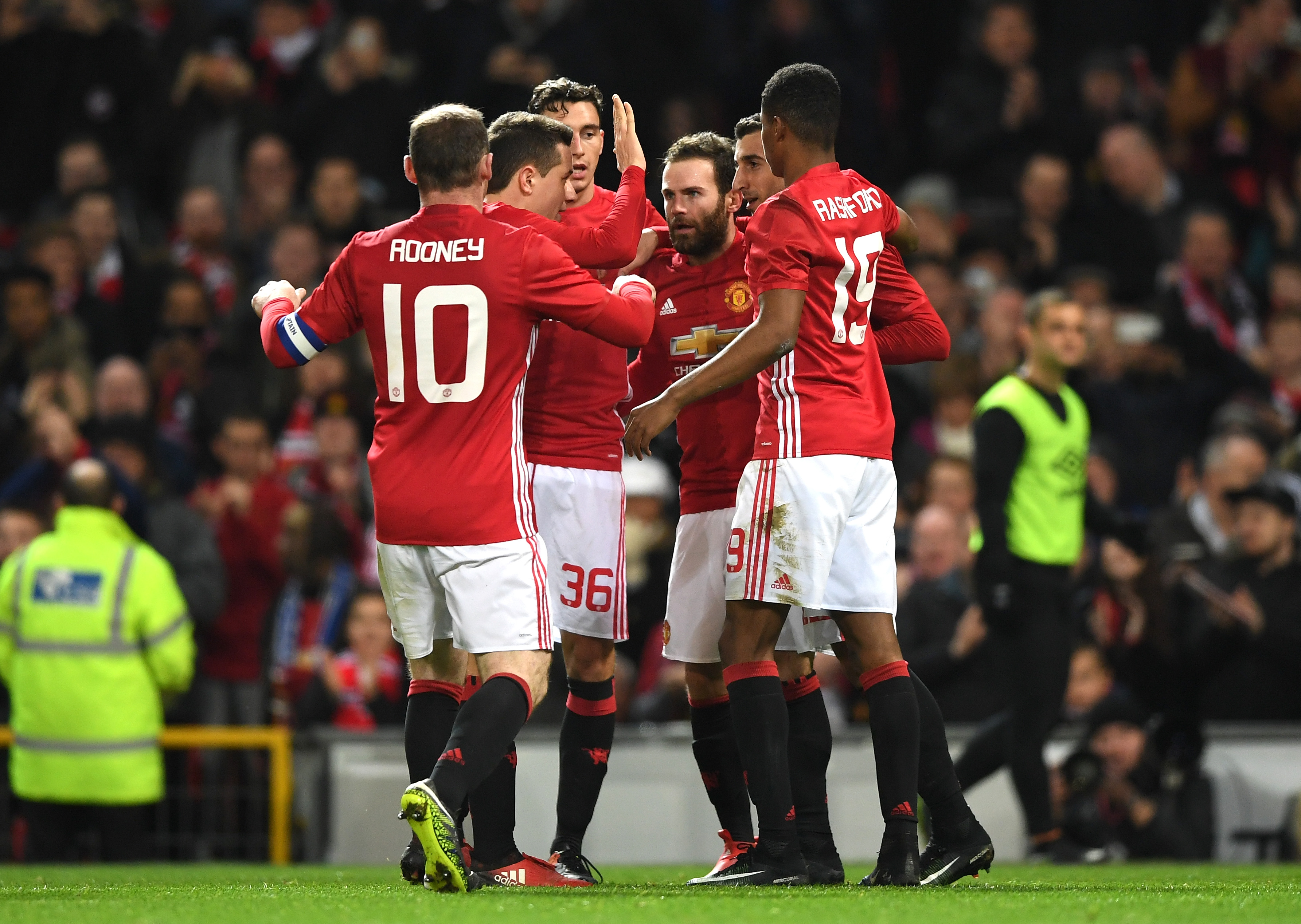 MANCHESTER, ENGLAND - JANUARY 10:  Juan Mata of Manchester United celebrates with team mates after scoring his sides first goal during the EFL Cup Semi-Final First Leg match between Manchester United and Hull City at Old Trafford on January 10, 2017 in Manchester, England.  (Photo by Shaun Botterill/Getty Images)