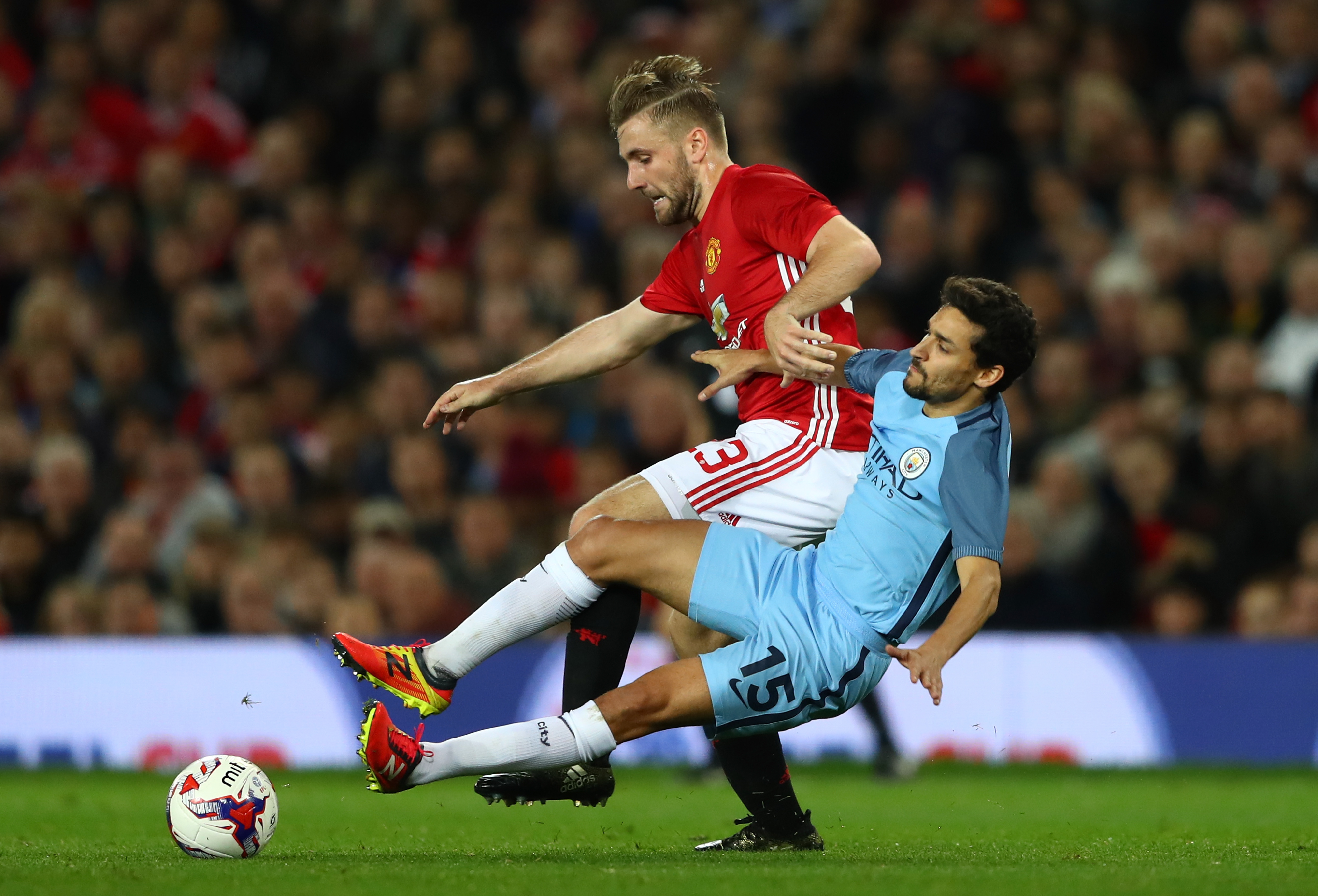 MANCHESTER, ENGLAND - OCTOBER 26: Luke Shaw of Manchester United (L) and Jesus Navas of Manchester City (R) battle for possession during the EFL Cup fourth round match between Manchester United and Manchester City at Old Trafford on October 26, 2016 in Manchester, England.  (Photo by Michael Steele/Getty Images)