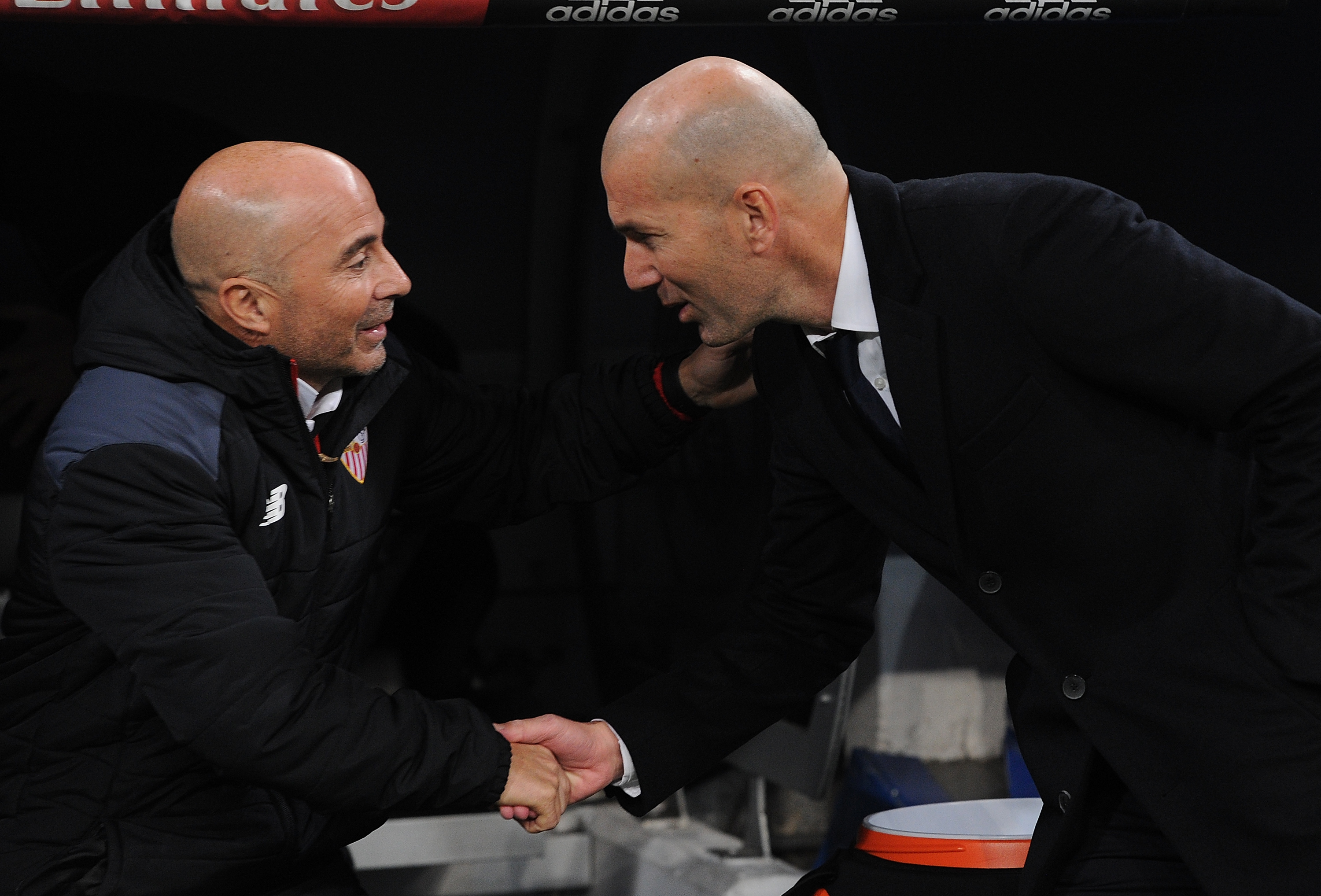 MADRID, SPAIN - JANUARY 04:  Real Madrid manager Zinedine Zidane greets Sevilla FC manager Jorge Sampaoli during the Copa del Rey Round of 16 First Leg match between Real Madrid and Sevilla  at Bernabeu on January 4, 2017 in Madrid, Spain.  (Photo by Denis Doyle/Getty Images)