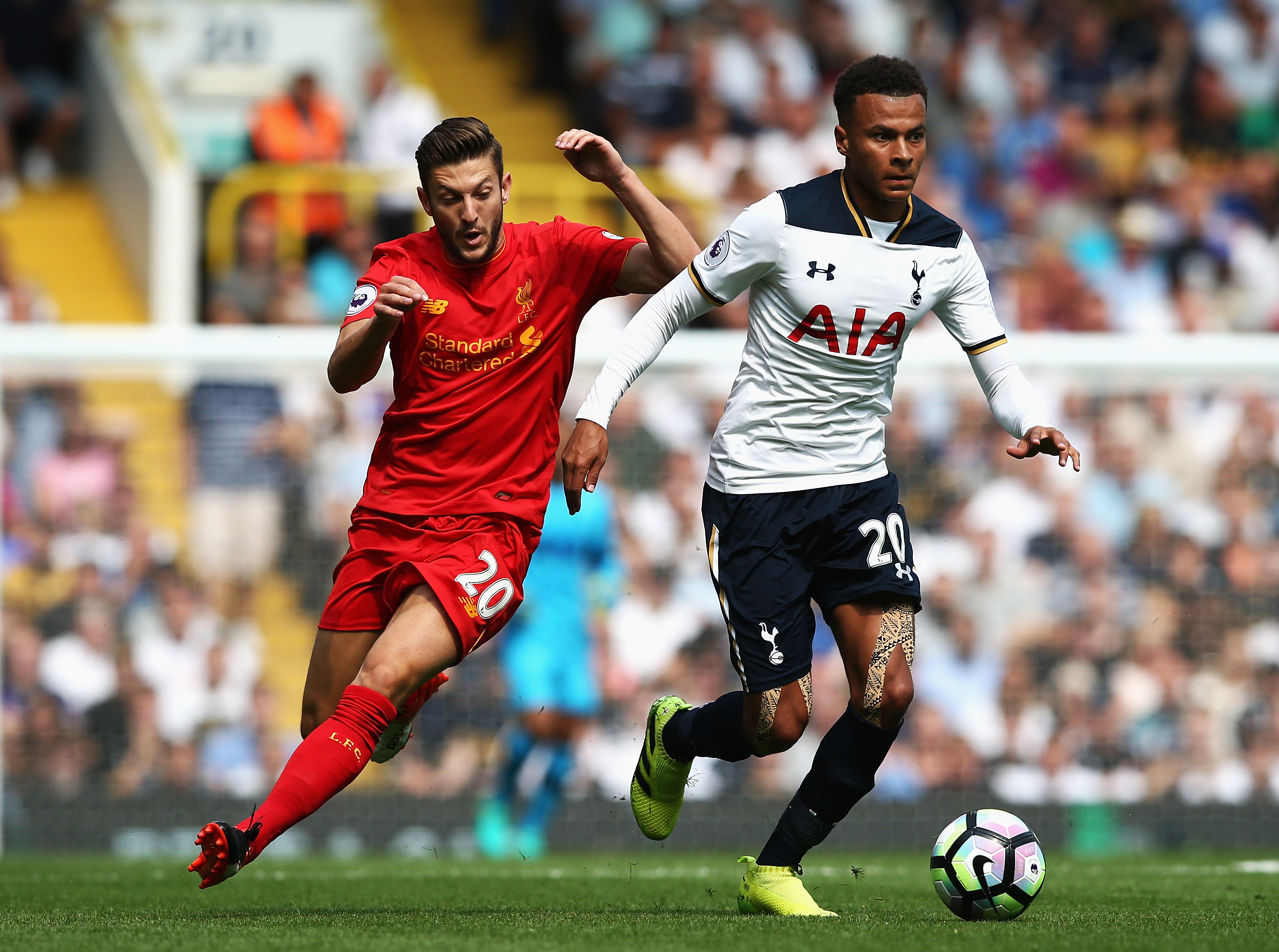 LONDON, ENGLAND - AUGUST 27: Dele Alli of Tottenham Hotspur is chased down by Adam Lallana of Liverpool during the Premier League match between Tottenham Hotspur and Liverpool at White Hart Lane on August 27, 2016 in London, England.  (Photo by Jan Kruger/Getty Images)