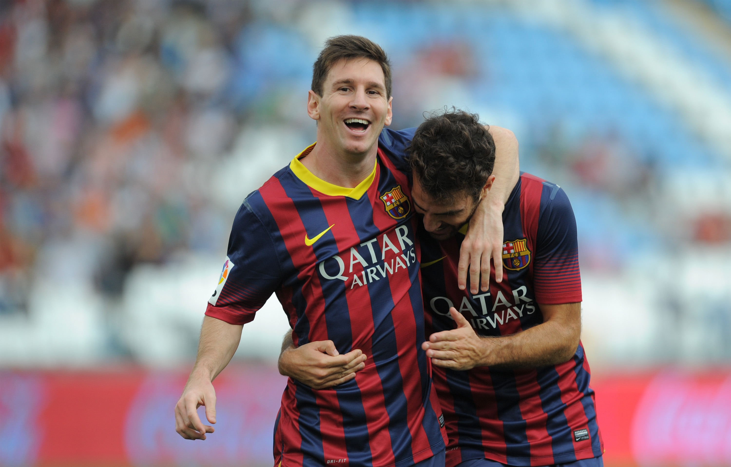ALMERIA, SPAIN - SEPTEMBER 28:  Lionel Messi (L) celebrates with Cesc Fabregas
 after scoring FC Barcelona's opening goal during the La Liga match between UD Almeria and FC Barcelona on September 28, 2013 in Almeria, Spain.  (Photo by Denis Doyle/Getty Images)
