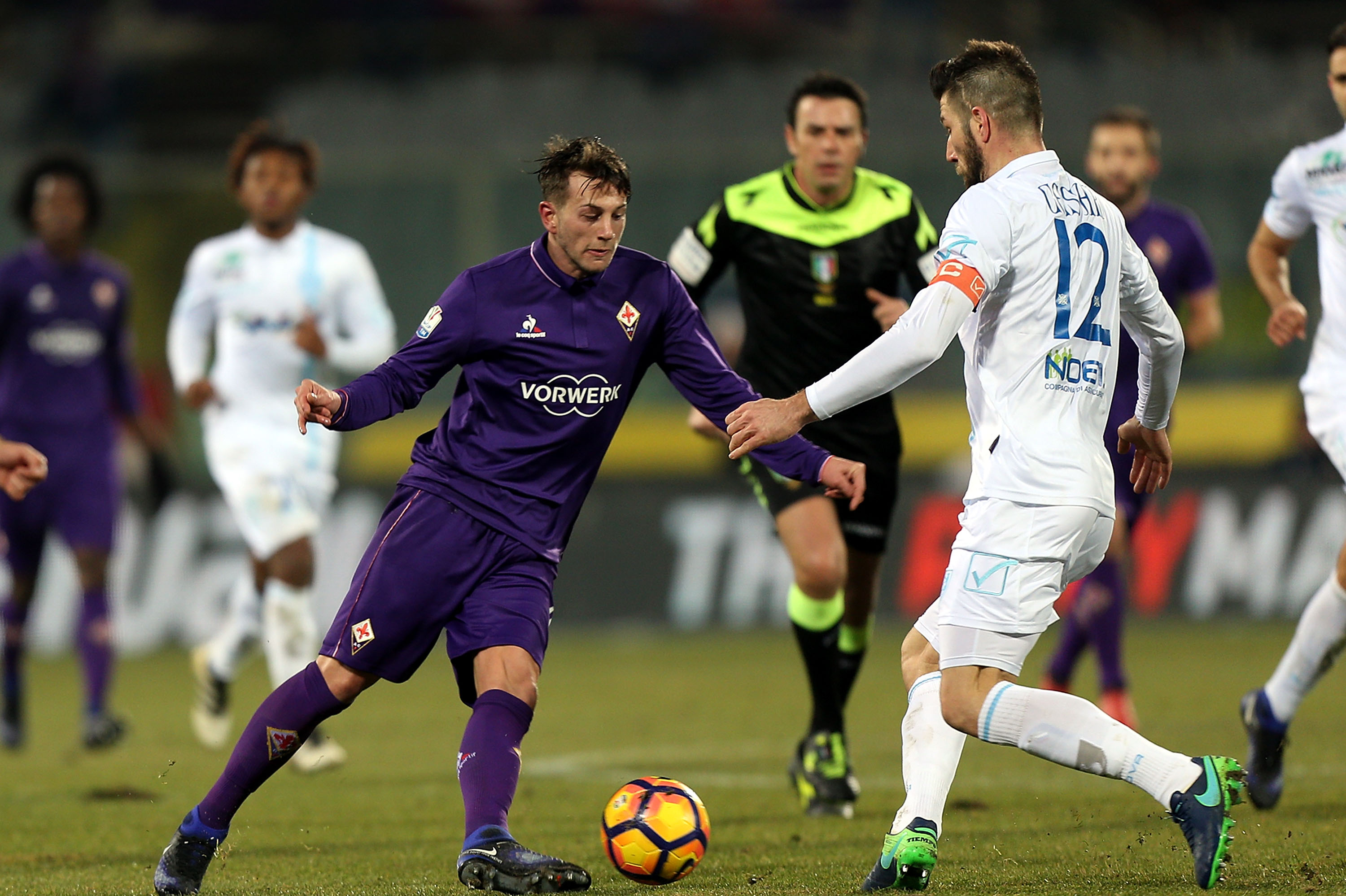 FLORENCE, ITALY - JANUARY 11: Federico Bernardeschi of ACF Fiorentina fights for the ball with Bostjan Cesar of AC Chievo Verona during the TIM Cup match between ACF Fiorentina and AC ChievoVerona at Stadio Artemio Franchi on January 11, 2017 in Florence, Italy.  (Photo by Gabriele Maltinti/Getty Images)