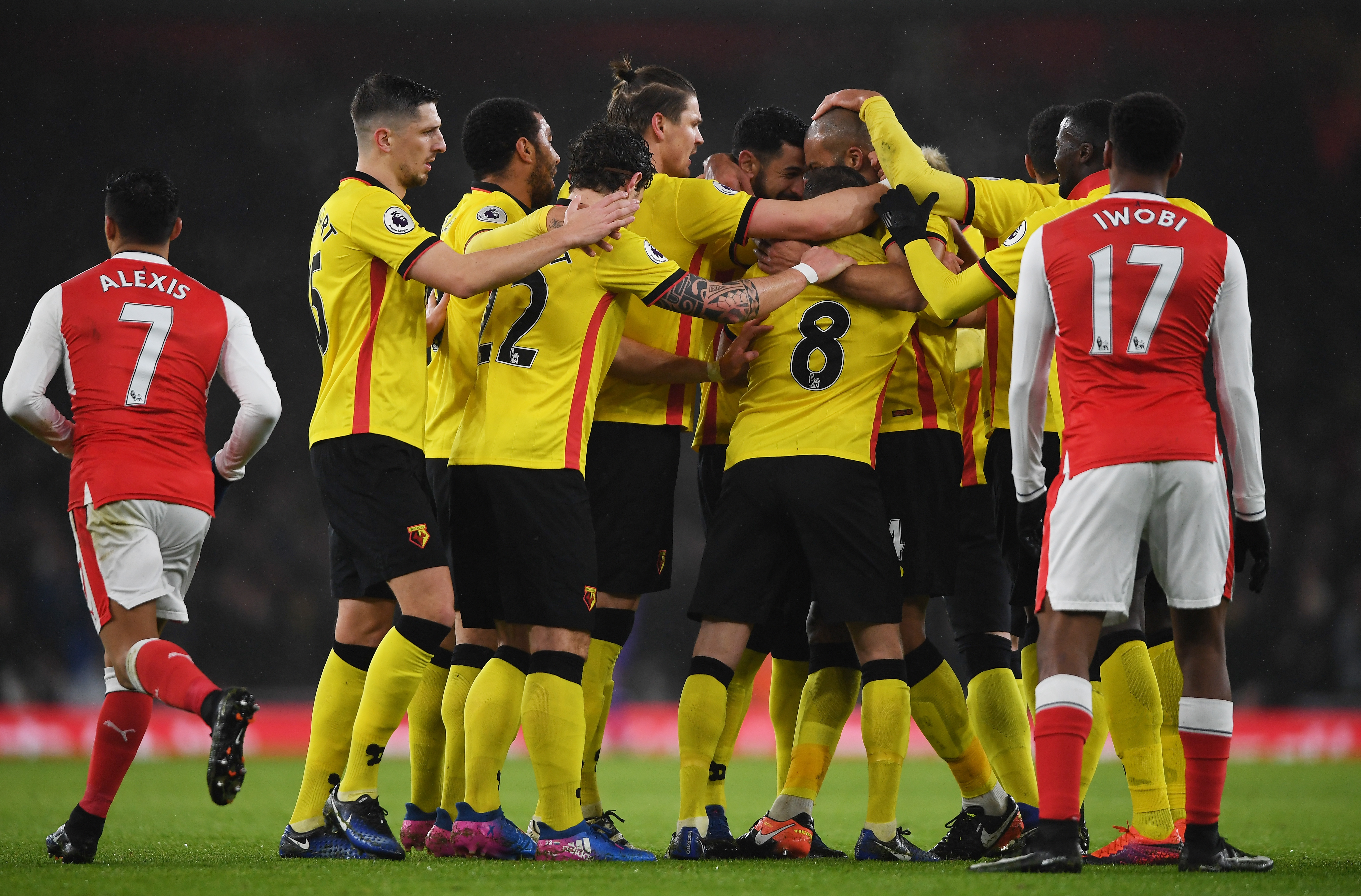 LONDON, ENGLAND - JANUARY 31:  Younes Kaboul of Watford is mobbed by team mates after scoring the opening goal during the Premier League match between Arsenal and Watford at Emirates Stadium on January 31, 2017 in London, England.  (Photo by Mike Hewitt/Getty Images)