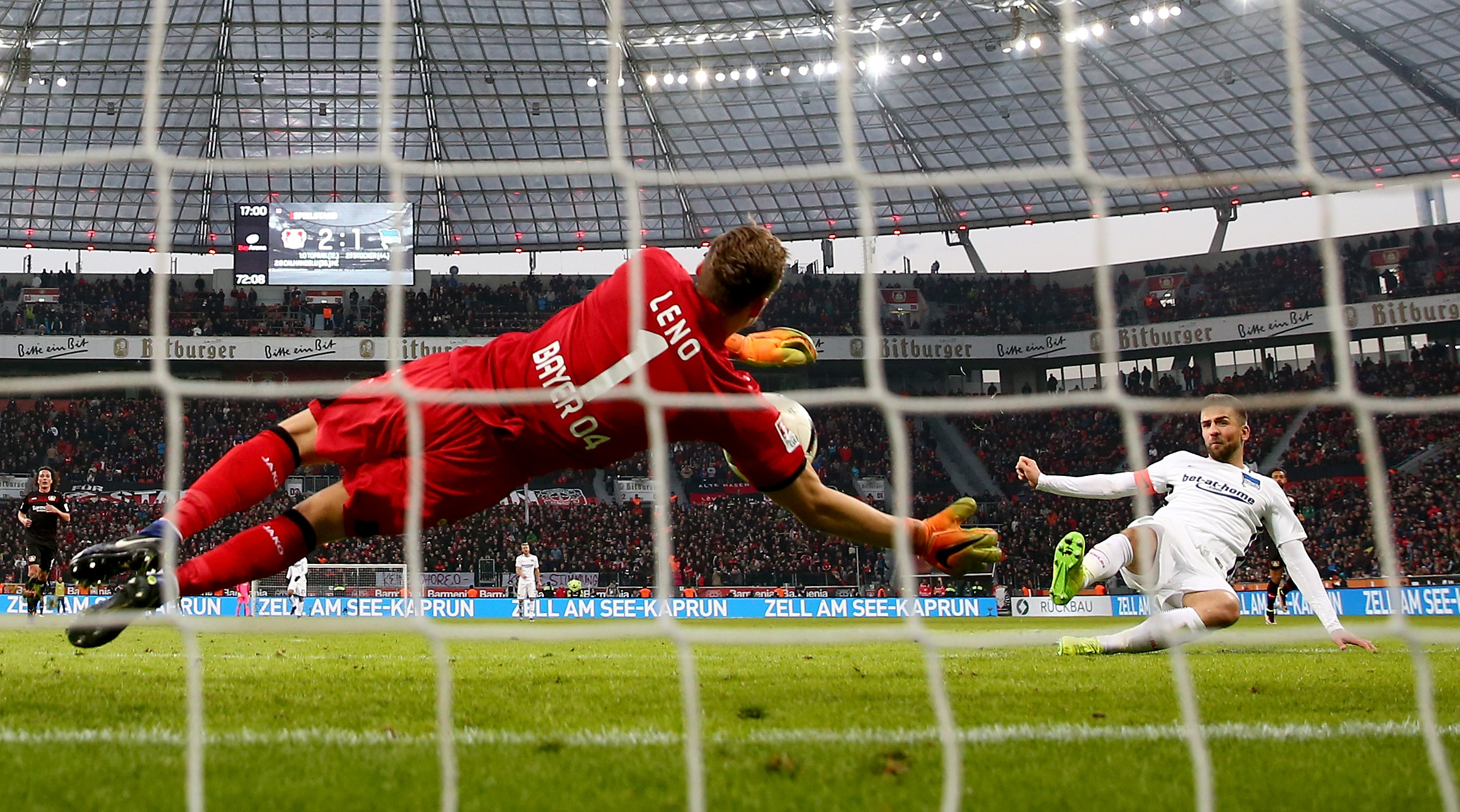 LEVERKUSEN, GERMANY - JANUARY 22:  Bernd Leno of Bayer Leverkusen saves a shot of Vedad Ibisevic of Berlin during the Bundesliga match between Bayer 04 Leverkusen and Hertha BSC at BayArena on January 22, 2017 in Leverkusen, Germany.  (Photo by Lars Baron/Bongarts/Getty Images)