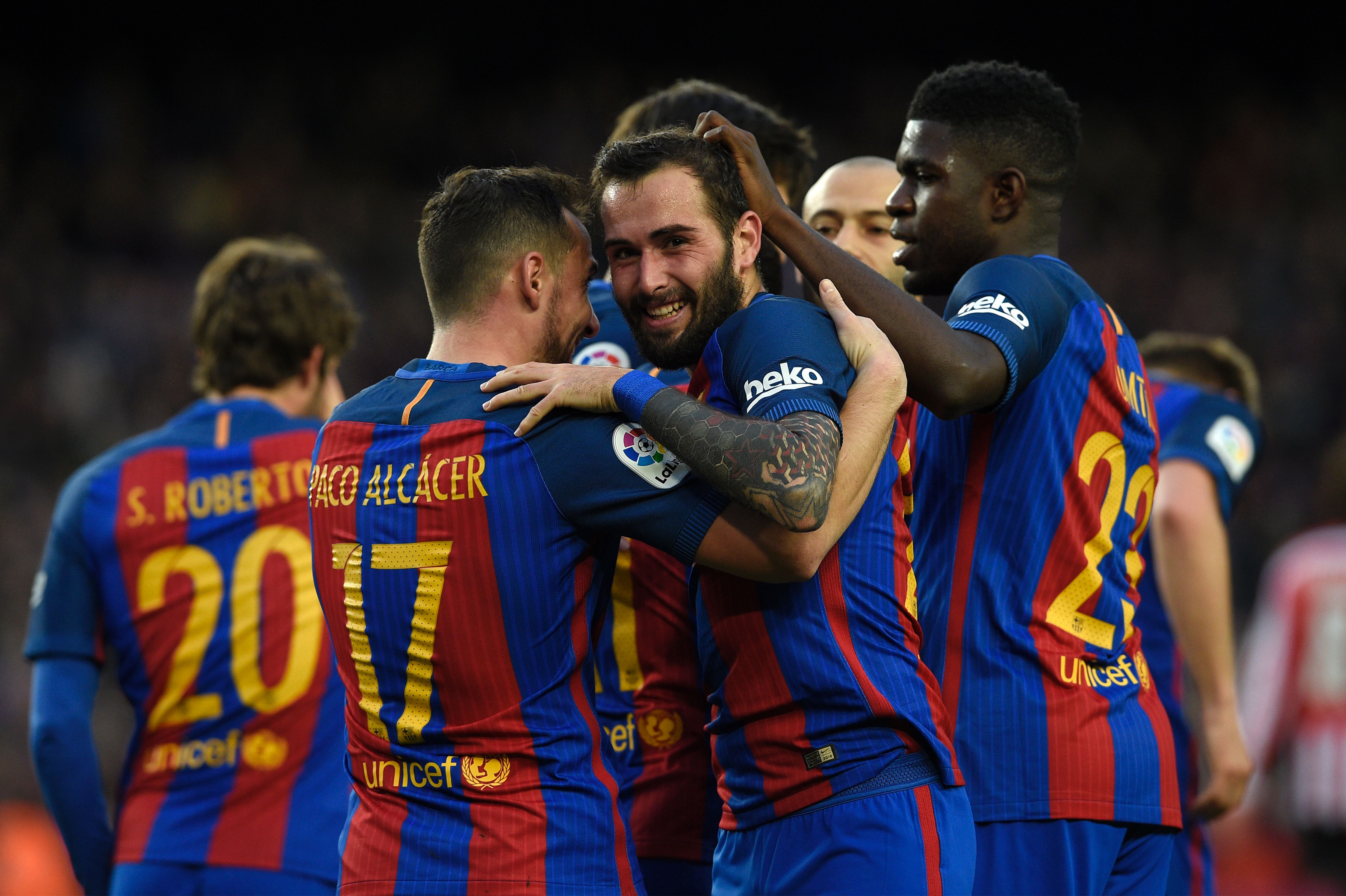 CORRECTION - Barcelona's defender Aleix Vidal (C) celebrates with teammates after scoring a goal during the Spanish league football match FC Barcelona vs Athletic Club Bilbao at the Camp Nou stadium in Barcelona on February 4, 2017.  / AFP / LLUIS GENE / The erroneous mention[s] appearing in the metadata of this photo by LLUIS GENE has been modified in AFP systems in the following manner: [Barcelona's defender Aleix Vidal (C)] instead of [Barcelona's forward Paco Alcacer (2L)]. Please immediately remove the erroneous mention[s] from all your online services and delete it (them) from your servers. If you have been authorized by AFP to distribute it (them) to third parties, please ensure that the same actions are carried out by them. Failure to promptly comply with these instructions will entail liability on your part for any continued or post notification usage. Therefore we thank you very much for all your attention and prompt action. We are sorry for the inconvenience this notification may cause and remain at your disposal for any further information you may require.        (Photo credit should read LLUIS GENE/AFP/Getty Images)