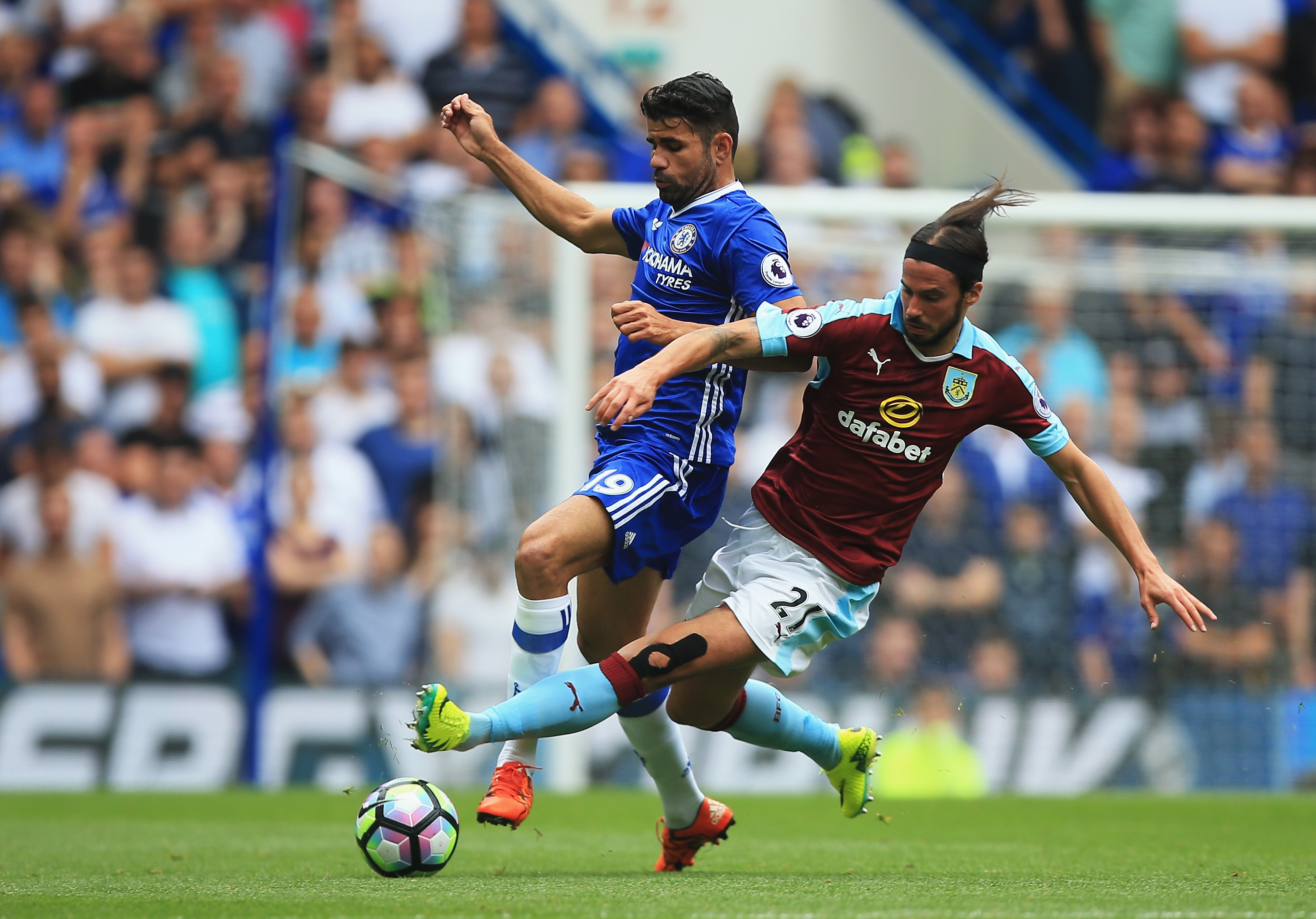 LONDON, ENGLAND - AUGUST 27: Diego Costa of Chelsea is fouled by George Boyd of Burnley during the Premier League match between Chelsea and Burnley at Stamford Bridge on August 27, 2016 in London, England.  (Photo by Ben Hoskins/Getty Images)