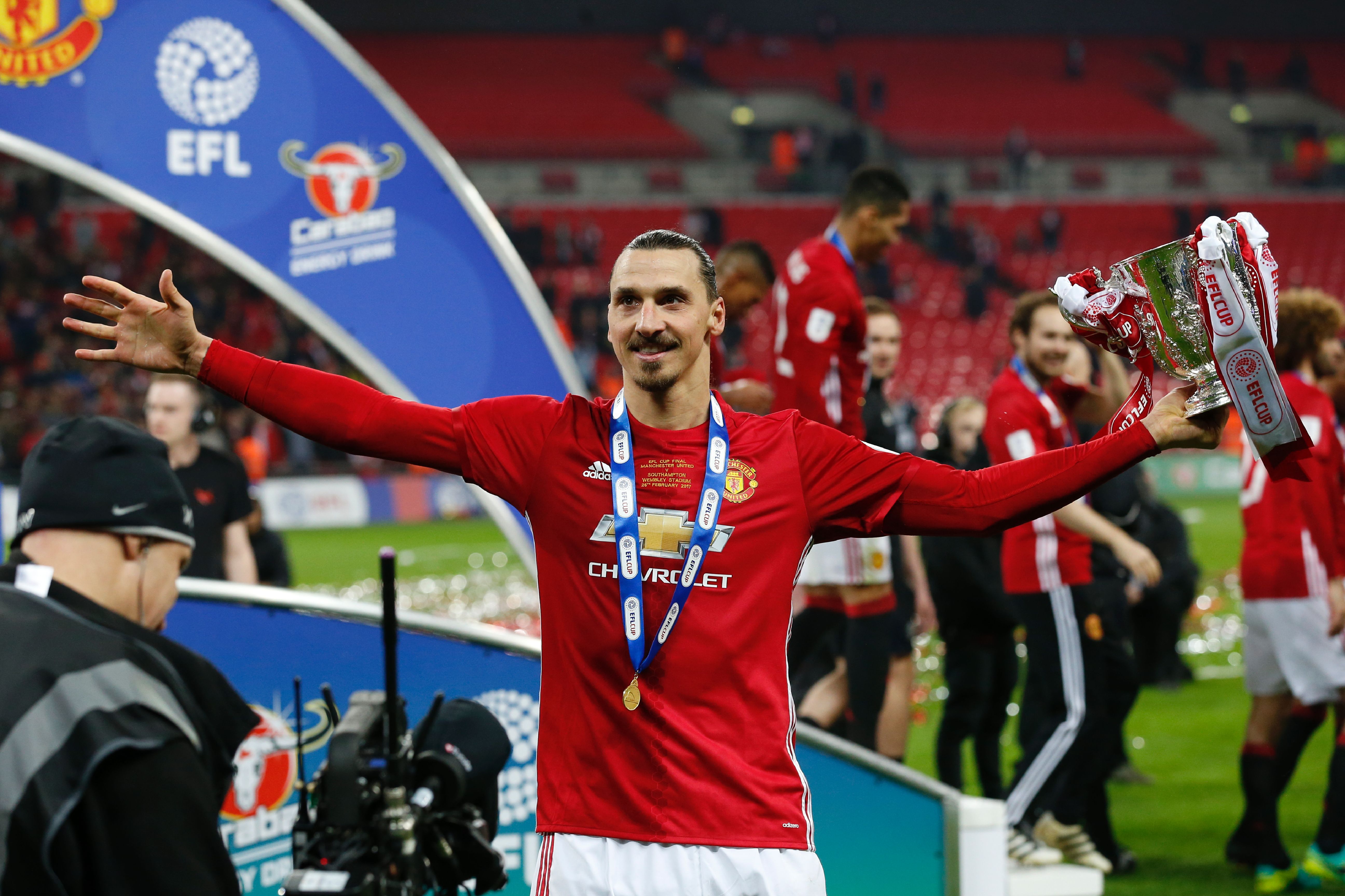 Manchester United's Swedish striker Zlatan Ibrahimovic celebrates with the trophy on the pitch after their victory in the English League Cup final football match between Manchester United and Southampton at Wembley stadium in north London on February 26, 2017.
Zlatan Ibrahimovic sealed the first major silverware of Jose Mourinho's Manchester United reign and broke Southampton's hearts as the Swedish star's late goal clinched a dramatic 3-2 victory in Sunday's League Cup final. / AFP / Ian KINGTON / RESTRICTED TO EDITORIAL USE. No use with unauthorized audio, video, data, fixture lists, club/league logos or 'live' services. Online in-match use limited to 75 images, no video emulation. No use in betting, games or single club/league/player publications.  /         (Photo credit should read IAN KINGTON/AFP/Getty Images)