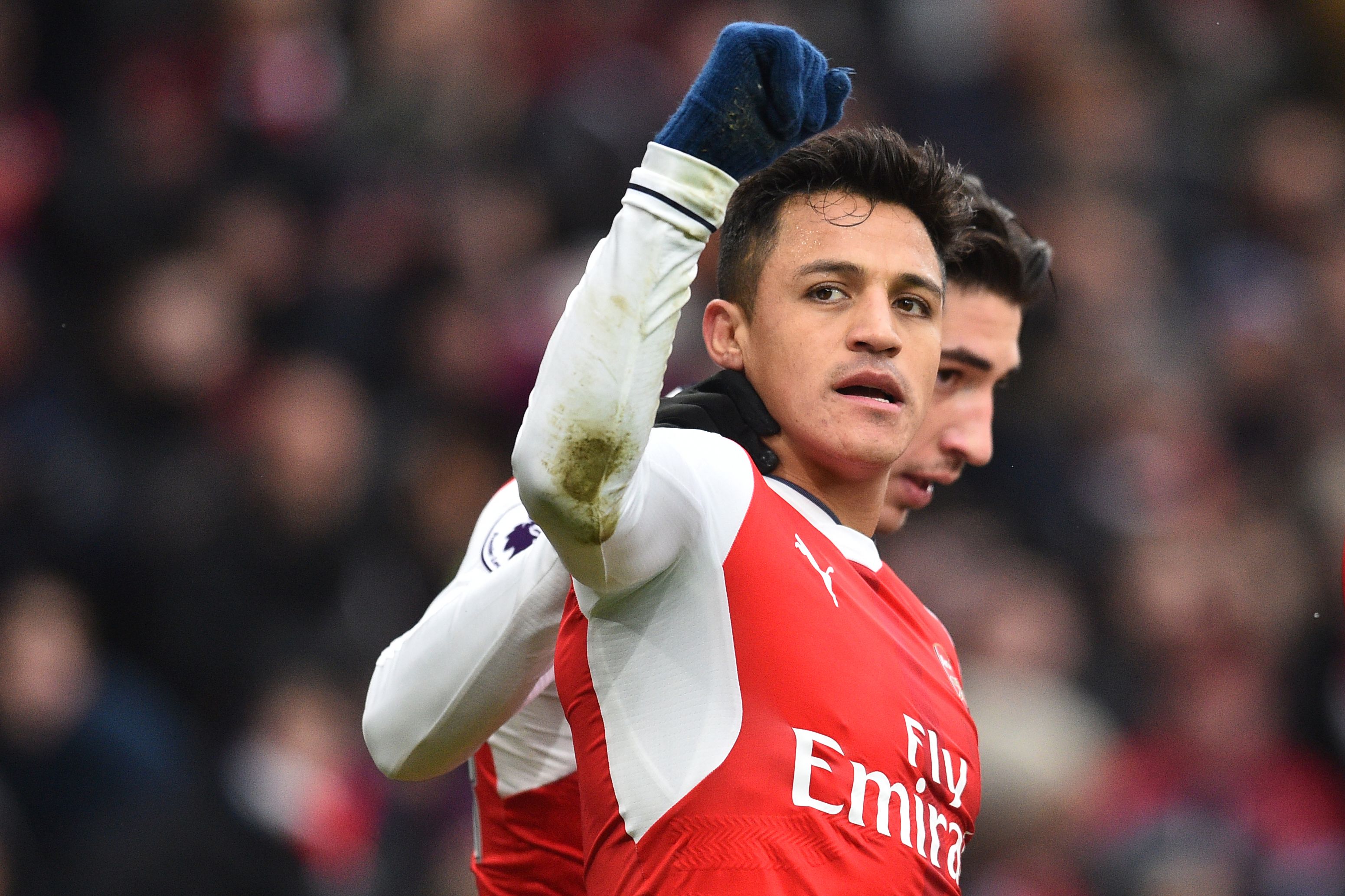 Arsenal's Chilean striker Alexis Sanchez (L) celebrates with Arsenal's Spanish defender Hector Bellerin after scoring the opening goal of the English Premier League football match between Arsenal and Hull City at the Emirates Stadium in London on February 11, 2017.  / AFP / Glyn KIRK / RESTRICTED TO EDITORIAL USE. No use with unauthorized audio, video, data, fixture lists, club/league logos or 'live' services. Online in-match use limited to 75 images, no video emulation. No use in betting, games or single club/league/player publications.  /         (Photo credit should read GLYN KIRK/AFP/Getty Images)