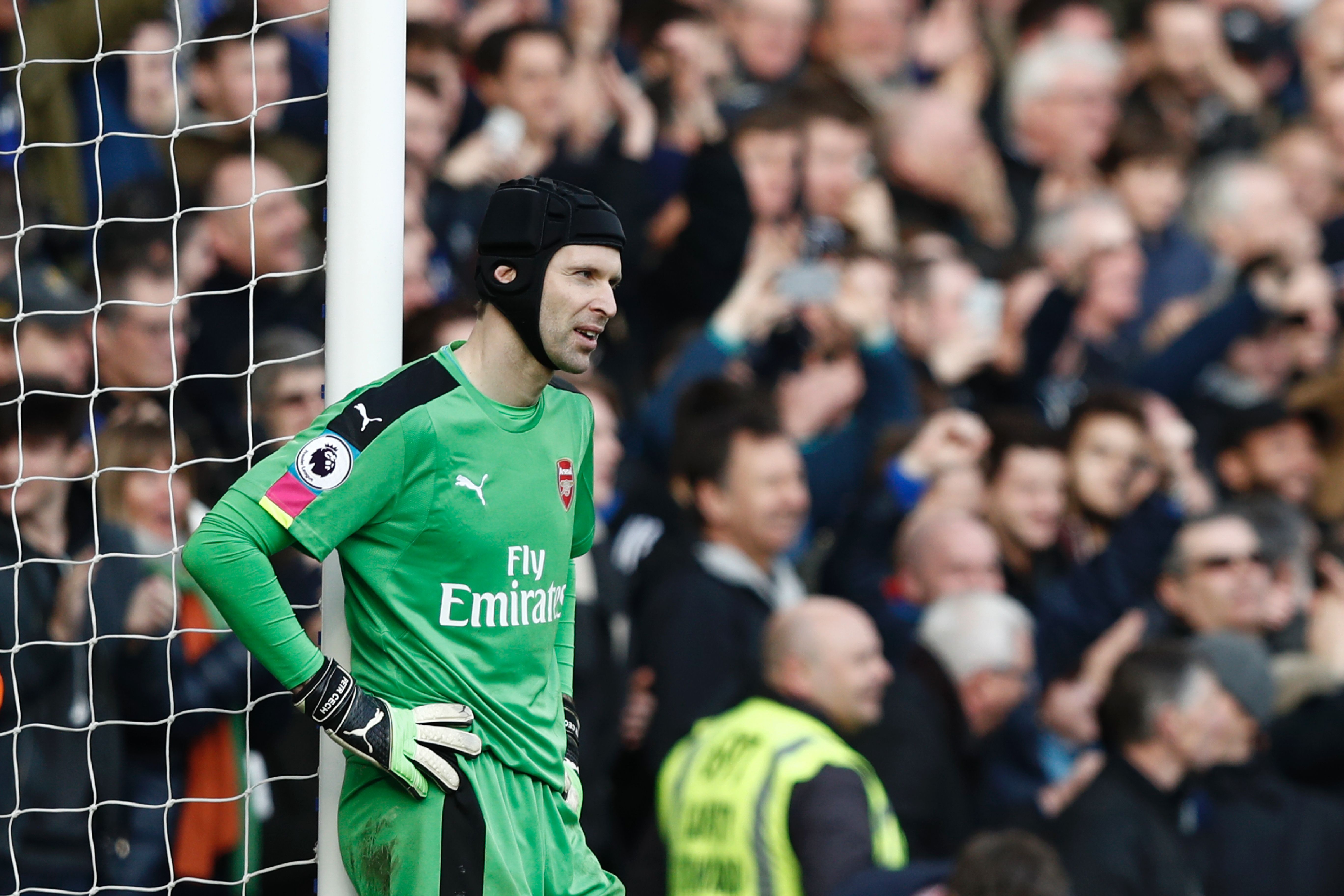 Arsenal's Czech goalkeeper Petr Cech reacts after Chelsea's Spanish midfielder Cesc Fabregas scored their third goal during the English Premier League football match between Chelsea and Arsenal at Stamford Bridge in London on February 4, 2017. / AFP / Adrian DENNIS / RESTRICTED TO EDITORIAL USE. No use with unauthorized audio, video, data, fixture lists, club/league logos or 'live' services. Online in-match use limited to 75 images, no video emulation. No use in betting, games or single club/league/player publications.  /         (Photo credit should read ADRIAN DENNIS/AFP/Getty Images)