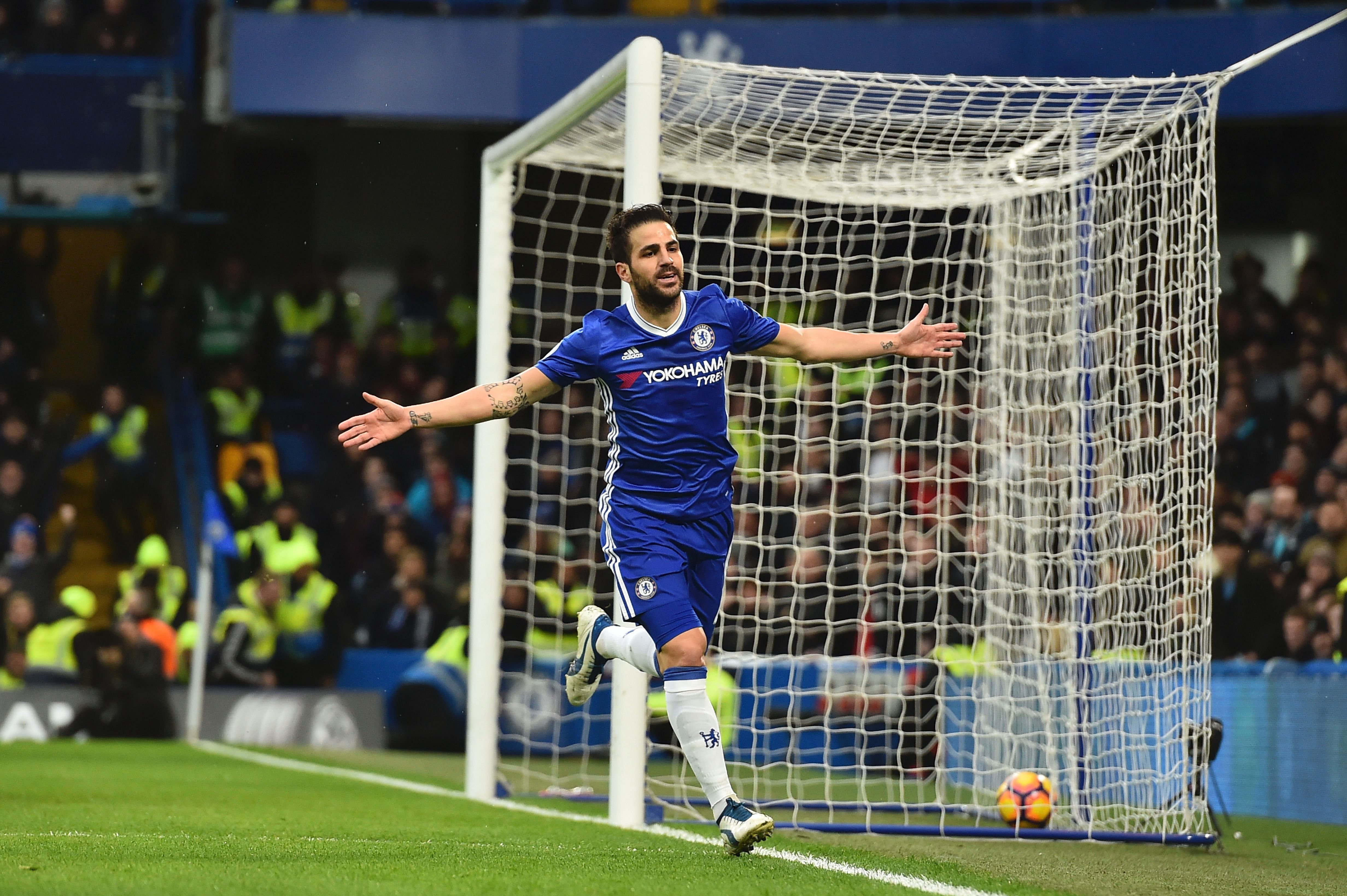 Chelsea's Spanish midfielder Cesc Fabregas celebrates scoring the opening goal during the English Premier League football match between Chelsea and Swansea at Stamford Bridge in London on February 25, 2017. / AFP / Glyn KIRK / RESTRICTED TO EDITORIAL USE. No use with unauthorized audio, video, data, fixture lists, club/league logos or 'live' services. Online in-match use limited to 75 images, no video emulation. No use in betting, games or single club/league/player publications.  /         (Photo credit should read GLYN KIRK/AFP/Getty Images)