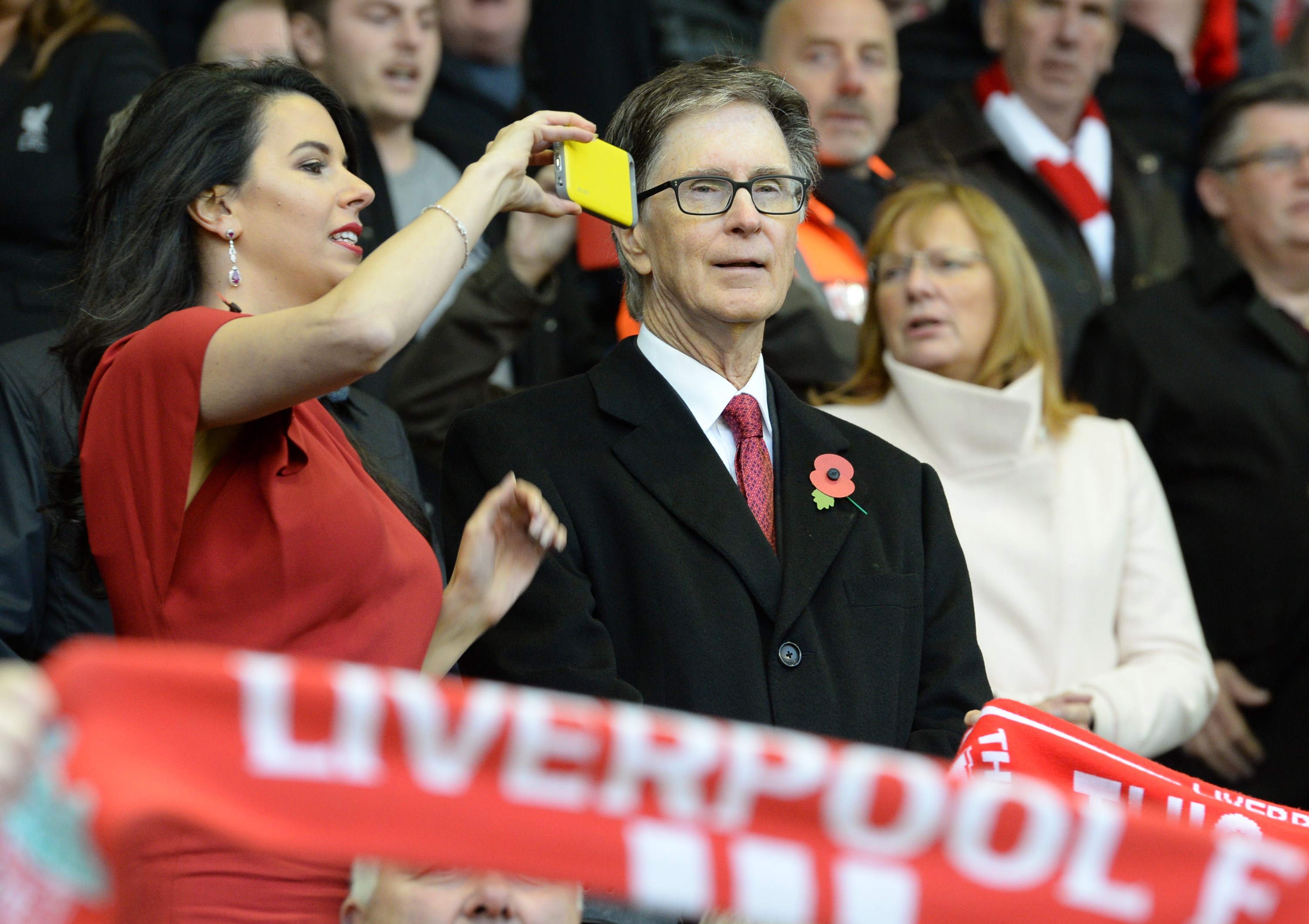 Liverpool's US owner John W. Henry's wife Linda Pizzuti (L) takes a photograph during the English Premier League football match between Liverpool and Southampton at Anfield stadium in Liverpool, north west England on October 25, 2015. AFP PHOTO / OLI SCARFF

RESTRICTED TO EDITORIAL USE. No use with unauthorized audio, video, data, fixture lists, club/league logos or 'live' services. Online in-match use limited to 75 images, no video emulation. No use in betting, games or single club/league/player publications.        (Photo credit should read OLI SCARFF/AFP/Getty Images)