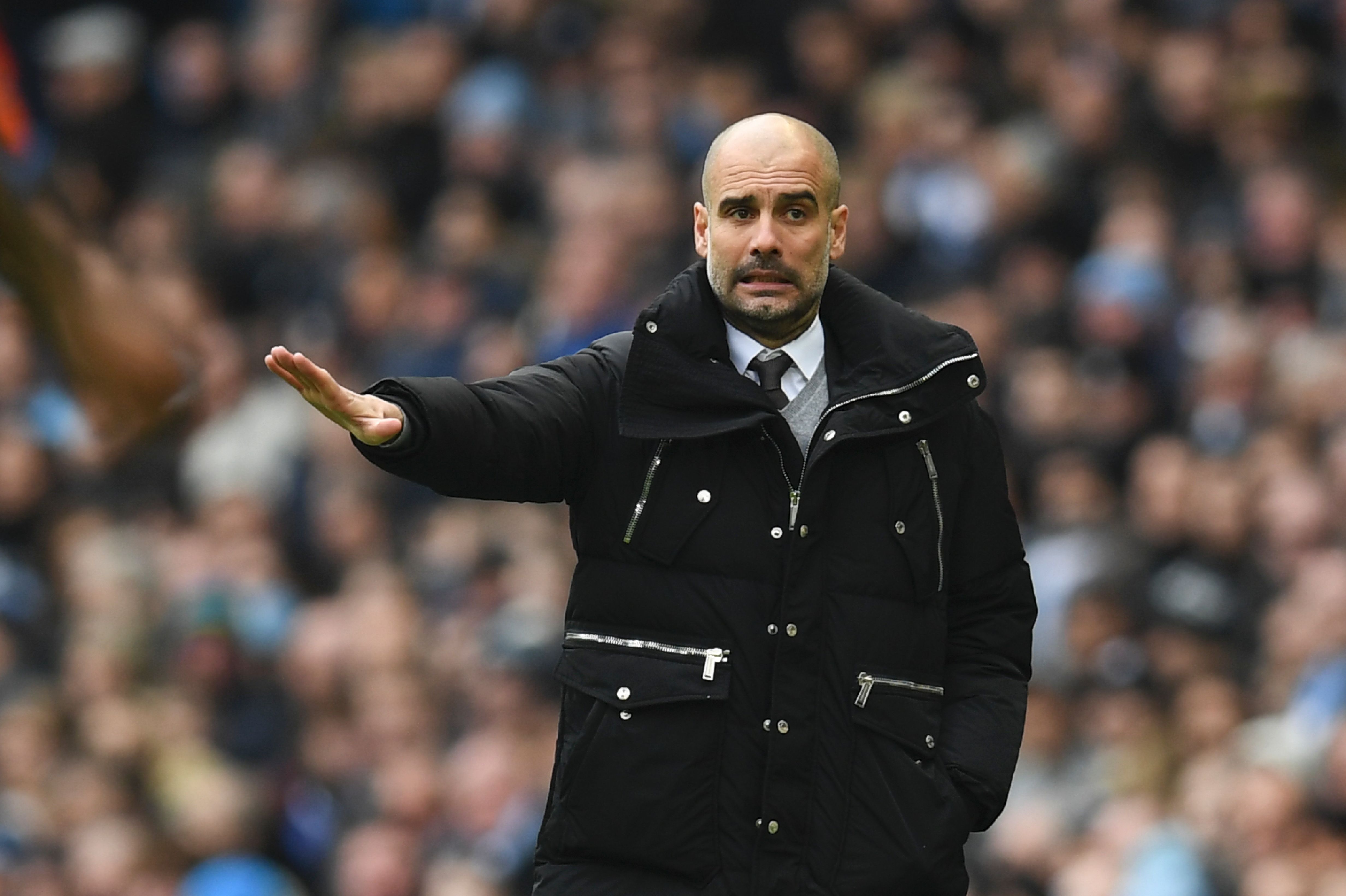 Manchester City's Spanish manager Pep Guardiola gestures on the touchline during the English Premier League football match between Manchester City and Swansea City at the Etihad Stadium in Manchester, north west England, on February 5, 2017. / AFP / Paul ELLIS / RESTRICTED TO EDITORIAL USE. No use with unauthorized audio, video, data, fixture lists, club/league logos or 'live' services. Online in-match use limited to 75 images, no video emulation. No use in betting, games or single club/league/player publications.  /         (Photo credit should read PAUL ELLIS/AFP/Getty Images)