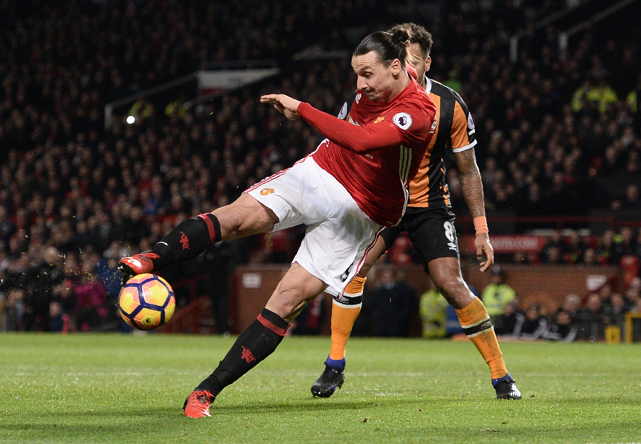 Manchester United's Swedish striker Zlatan Ibrahimovic shoots but fail to score during the English Premier League football match between Manchester United and Hull City at Old Trafford in Manchester, north west England, on February 1, 2017. / AFP / Oli SCARFF / RESTRICTED TO EDITORIAL USE. No use with unauthorized audio, video, data, fixture lists, club/league logos or 'live' services. Online in-match use limited to 75 images, no video emulation. No use in betting, games or single club/league/player publications.  /         (Photo credit should read OLI SCARFF/AFP/Getty Images)