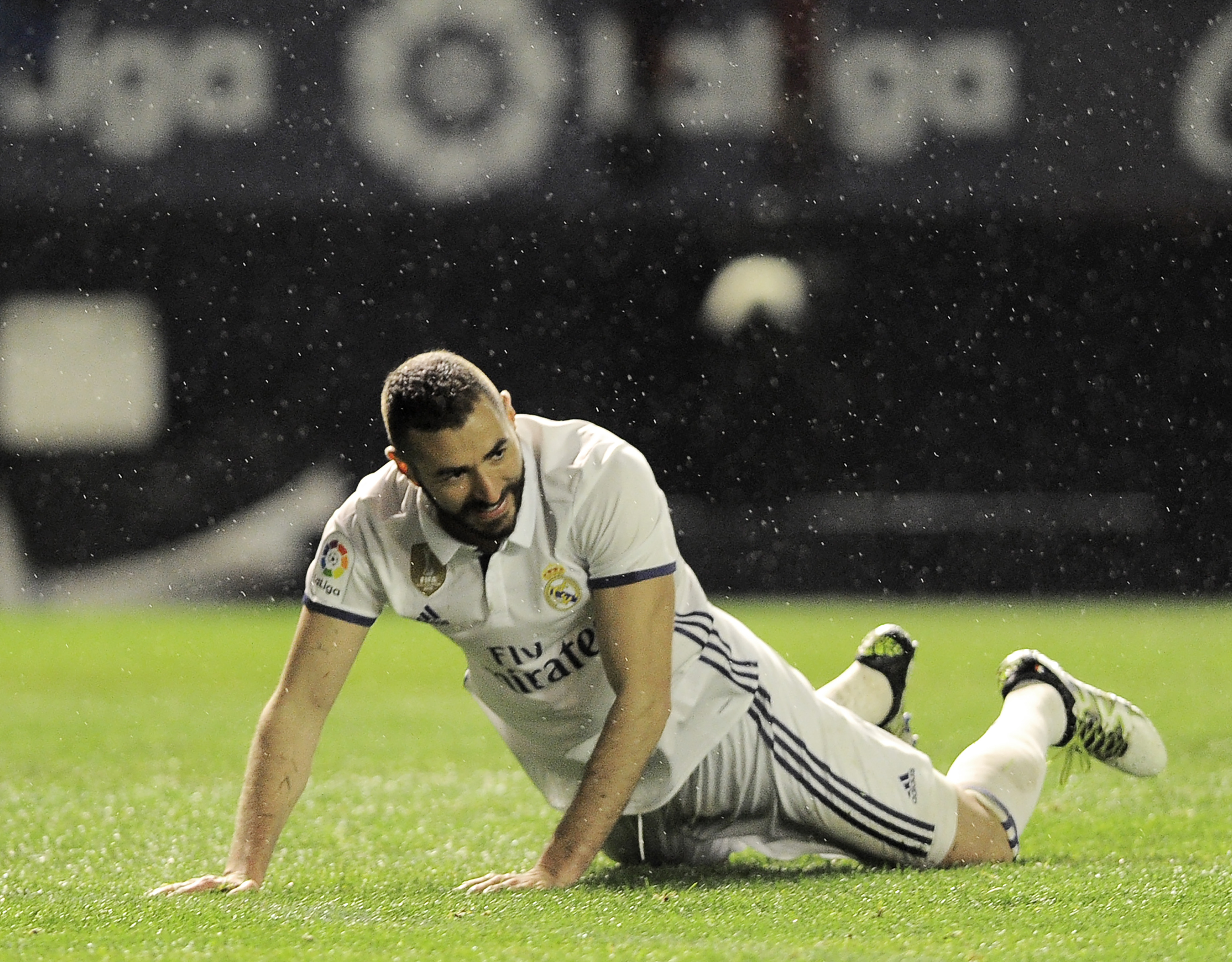 Real Madrid's French forward Karim Benzema lies on the ground during the Spanish league football match CA Osasuna vs Real Madrid CF at El Sadar stadium in Pamplona on February 11, 2017. / AFP / ANDER GILLENEA        (Photo credit should read ANDER GILLENEA/AFP/Getty Images)