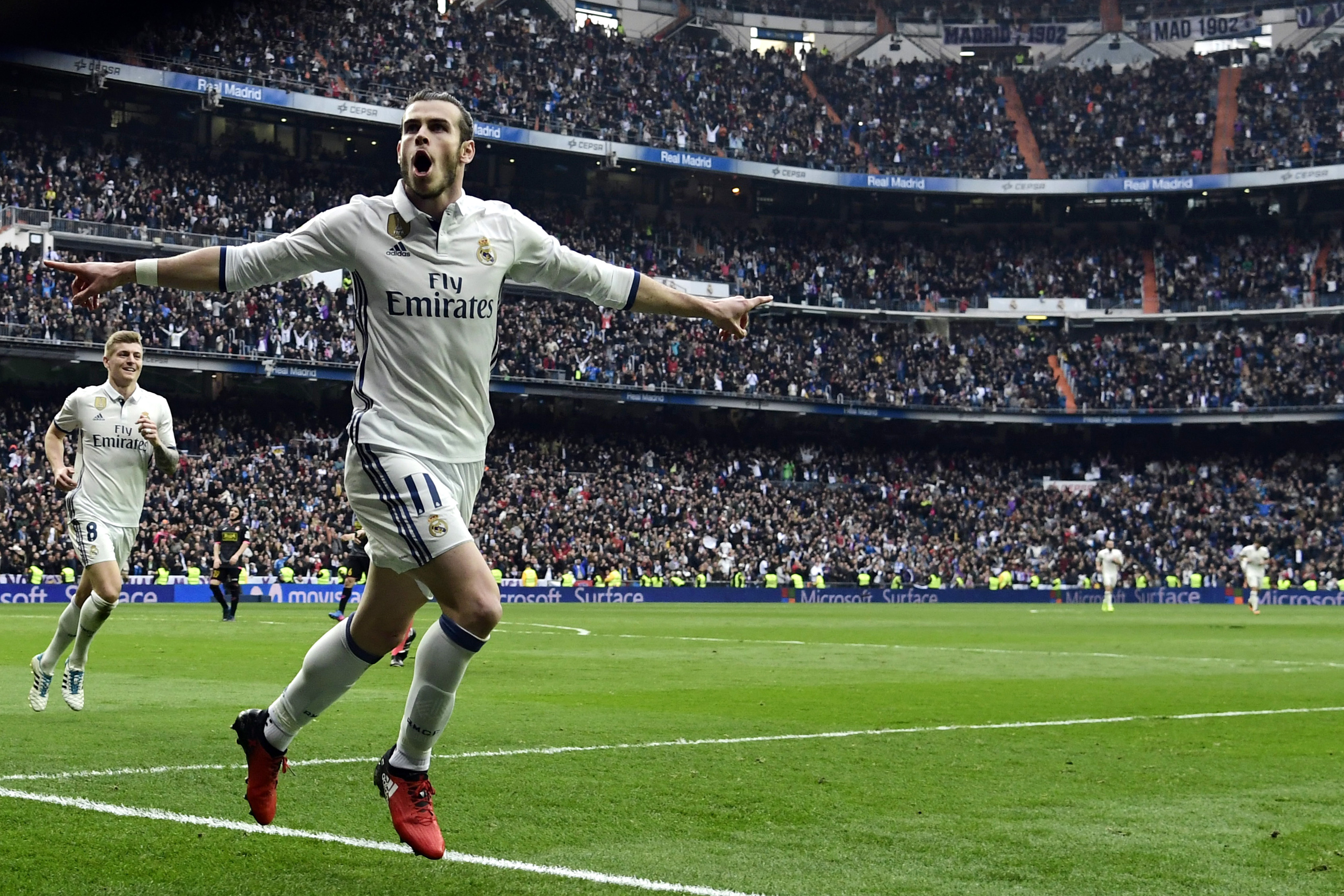 Real Madrid's Welsh forward Gareth Bale celebrates a goal during the Spanish league football match Real Madrid CF vs RCD Espanyol at the Santiago Bernabeu stadium in Madrid on February 18, 2017. / AFP / JAVIER SORIANO        (Photo credit should read JAVIER SORIANO/AFP/Getty Images)