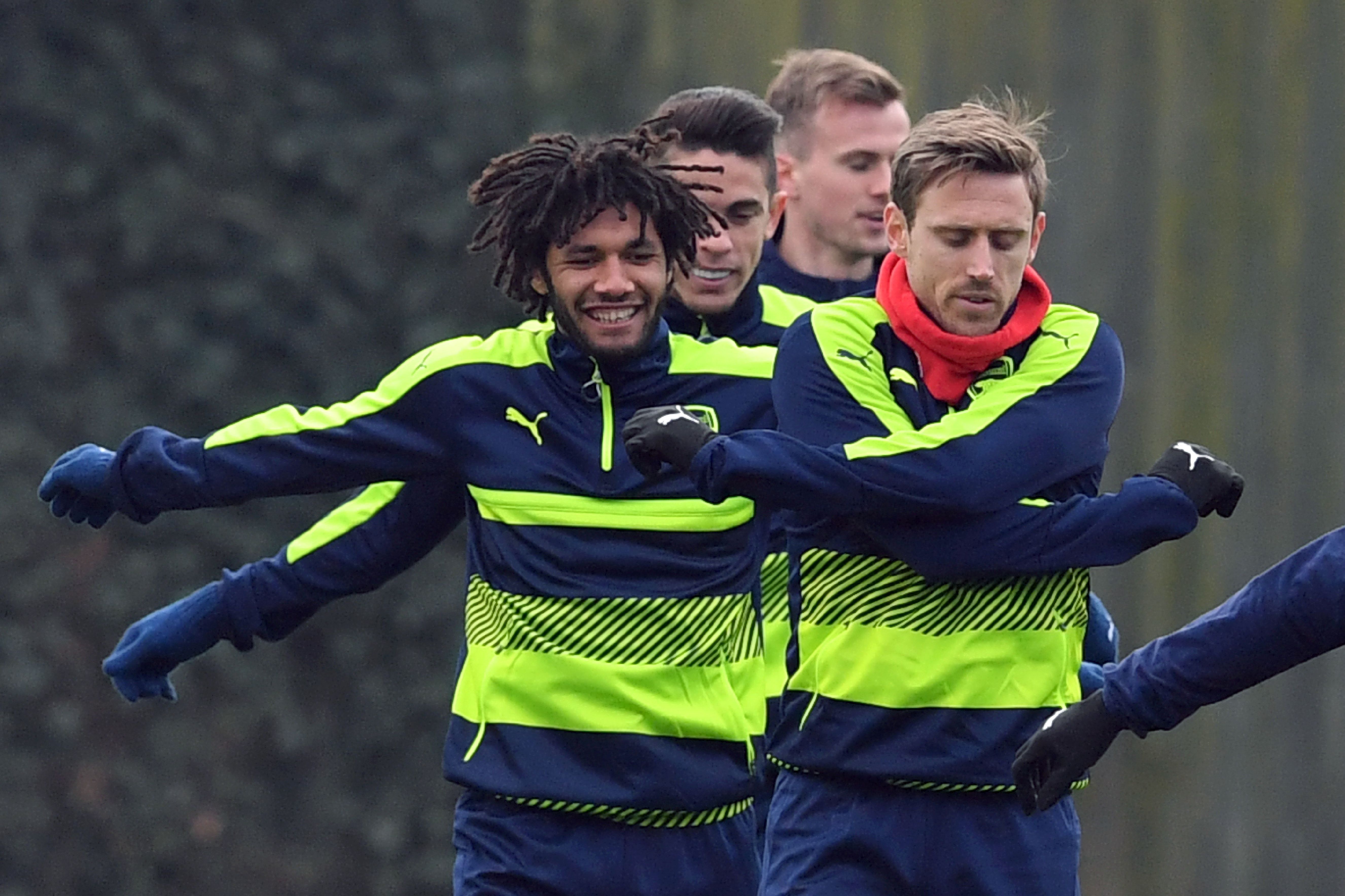 Arsenal's Egyptian midfielder Mohamed Elneny (L), Arsenal's Brazilian defender Gabriel (C), and Arsenal's Spanish defender Nacho Monreal (R) take part in a training session on the eve of their UEFA Champions League round of 16 1st leg football match against Bayern Munich, at Arsenal's London Colney training ground on February 14, 2017. / AFP / BEN STANSALL        (Photo credit should read BEN STANSALL/AFP/Getty Images)