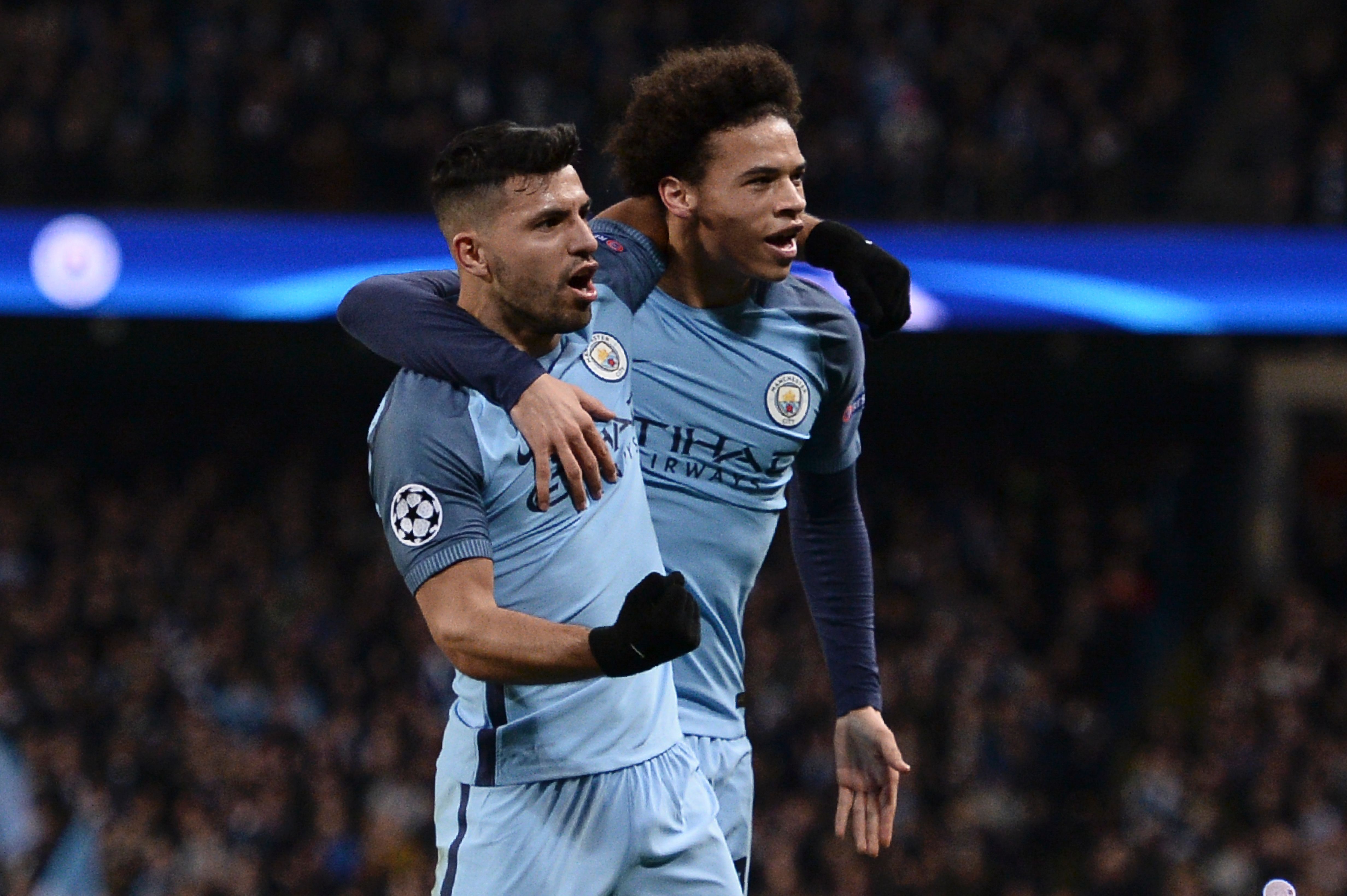 Manchester City's Argentinian striker Sergio Aguero (L) celebrates scoring their second goal with Manchester City's German midfielder Leroy Sane (R) during the UEFA Champions League Round of 16 first-leg football match between Manchester City and Monaco at the Etihad Stadium in Manchester, north west England on February 21, 2017. / AFP / Oli SCARFF        (Photo credit should read OLI SCARFF/AFP/Getty Images)