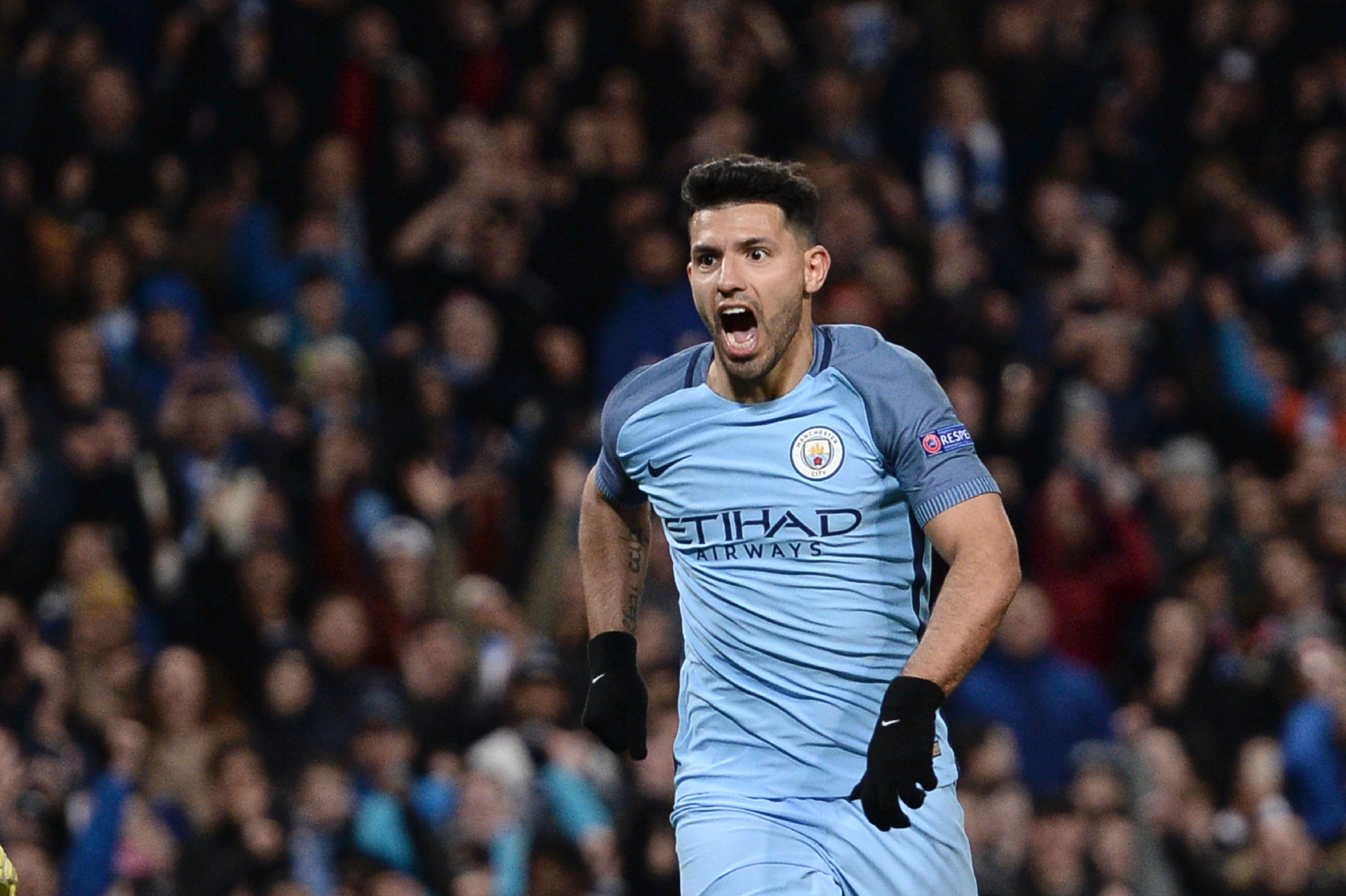 Manchester City's Argentinian striker Sergio Aguero celebrates scoring their second goal during the UEFA Champions League Round of 16 first-leg football match between Manchester City and Monaco at the Etihad Stadium in Manchester, north west England on February 21, 2017. / AFP / Oli SCARFF        (Photo credit should read OLI SCARFF/AFP/Getty Images)