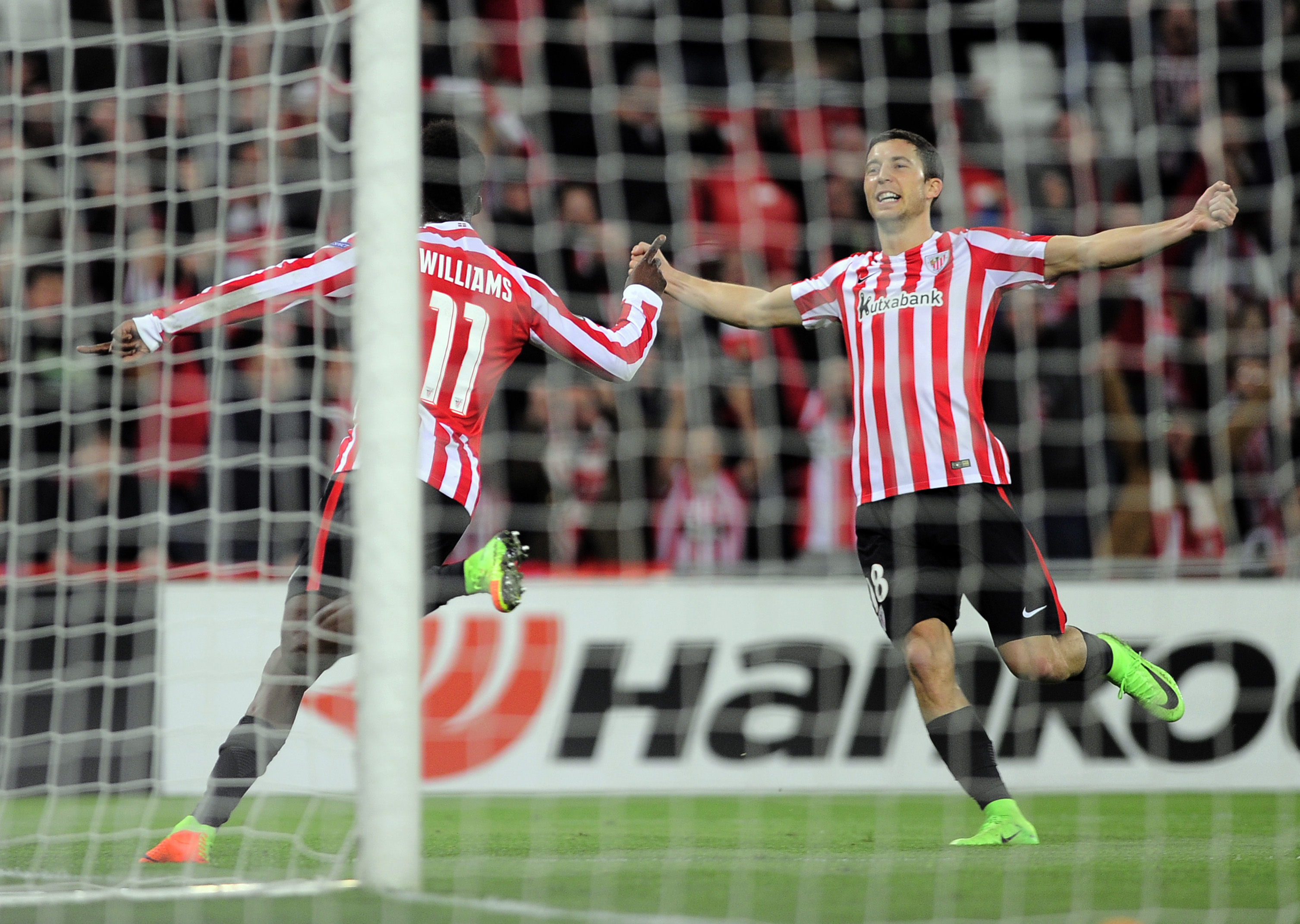 Athletic Bilbao's forward Inaki Williams Arthur (L) celebrates with teammate midfielder Oscar de Marcos (R) after scoring his team's third goal during the Europa League football match Athletic Club Bilbao vs APOEL Nicosia at the San Mames stadium in Bilbao on February 16, 2017. / AFP / ANDER GILLENEA        (Photo credit should read ANDER GILLENEA/AFP/Getty Images)