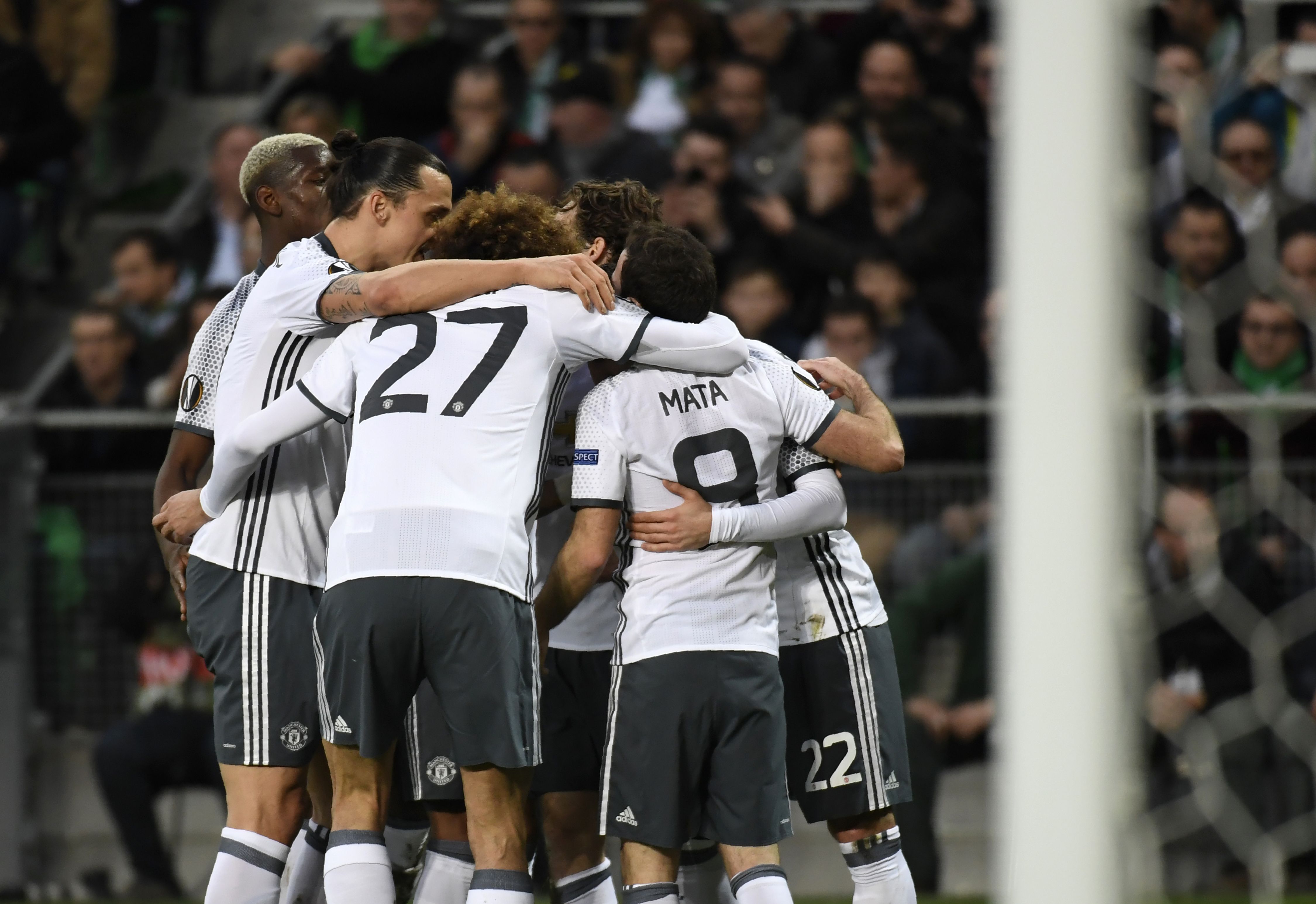 Manchester's United's Armenian forward Henrikh Mkhitaryan celebrates with teammates after scoring a goal during the UEFA Europa League football match between AS Saint-Etienne and Manchester United on February 22, 2017, at the Geoffroy Guichard stadium in Saint-Etienne, central France. / AFP / PHILIPPE DESMAZES        (Photo credit should read PHILIPPE DESMAZES/AFP/Getty Images)