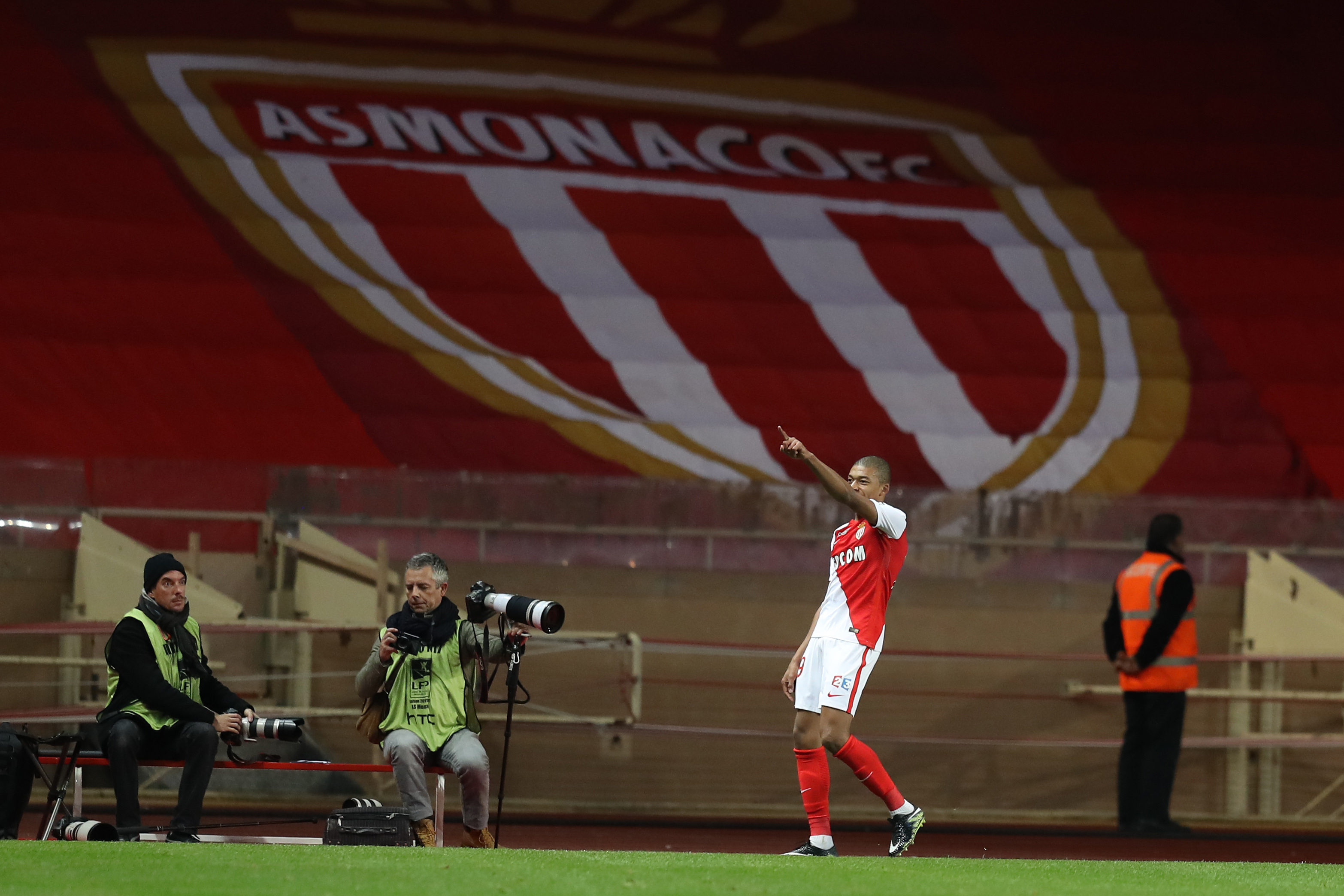 Monaco's French forward Kylian Mbappe Lottin celebrates after scoring during a French League Cup football match between Monaco (ASM) vs Rennes (SRFC) at the "Louis II" stadium in Monaco on December 14, 2016. / AFP / VALERY HACHE        (Photo credit should read VALERY HACHE/AFP/Getty Images)