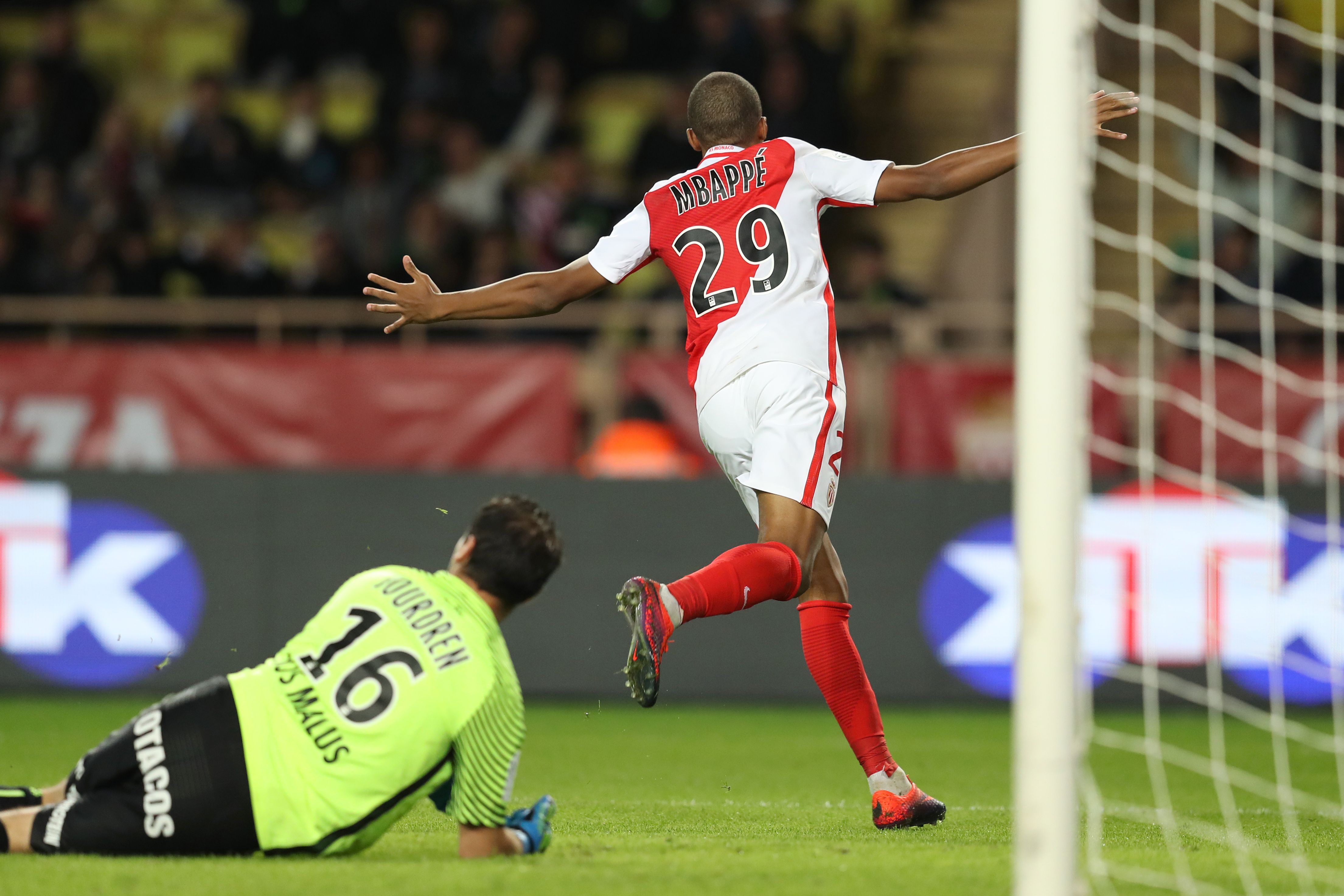 Monaco's French forward Kylian Mbappe Lottin celebrates after scoring a goal during the French L1 football match between AS Monaco and Montpellier at the Louis II Stadium in Monaco on October 21, 2016. / AFP / VALERY HACHE        (Photo credit should read VALERY HACHE/AFP/Getty Images)