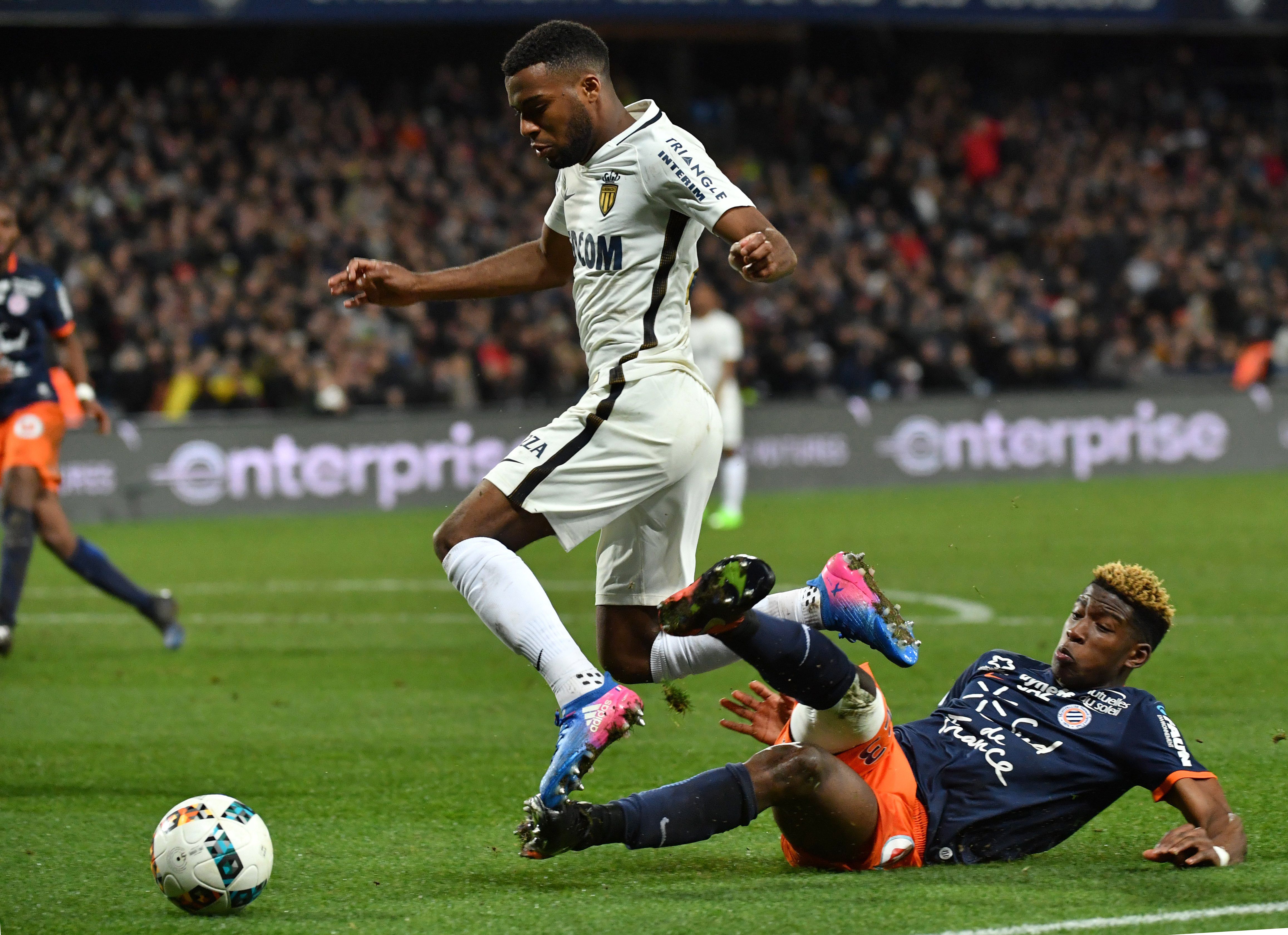 Monaco's French midfielder Thomas Lemar (L) vies with Montpellier's French defender Nordi Mukiele (R) during the French L1 football match between MHSC Montpellier and Monaco, on February 7, 2017 at the La Mosson Stadium in Montpellier, southern France. / AFP / PASCAL GUYOT        (Photo credit should read PASCAL GUYOT/AFP/Getty Images)