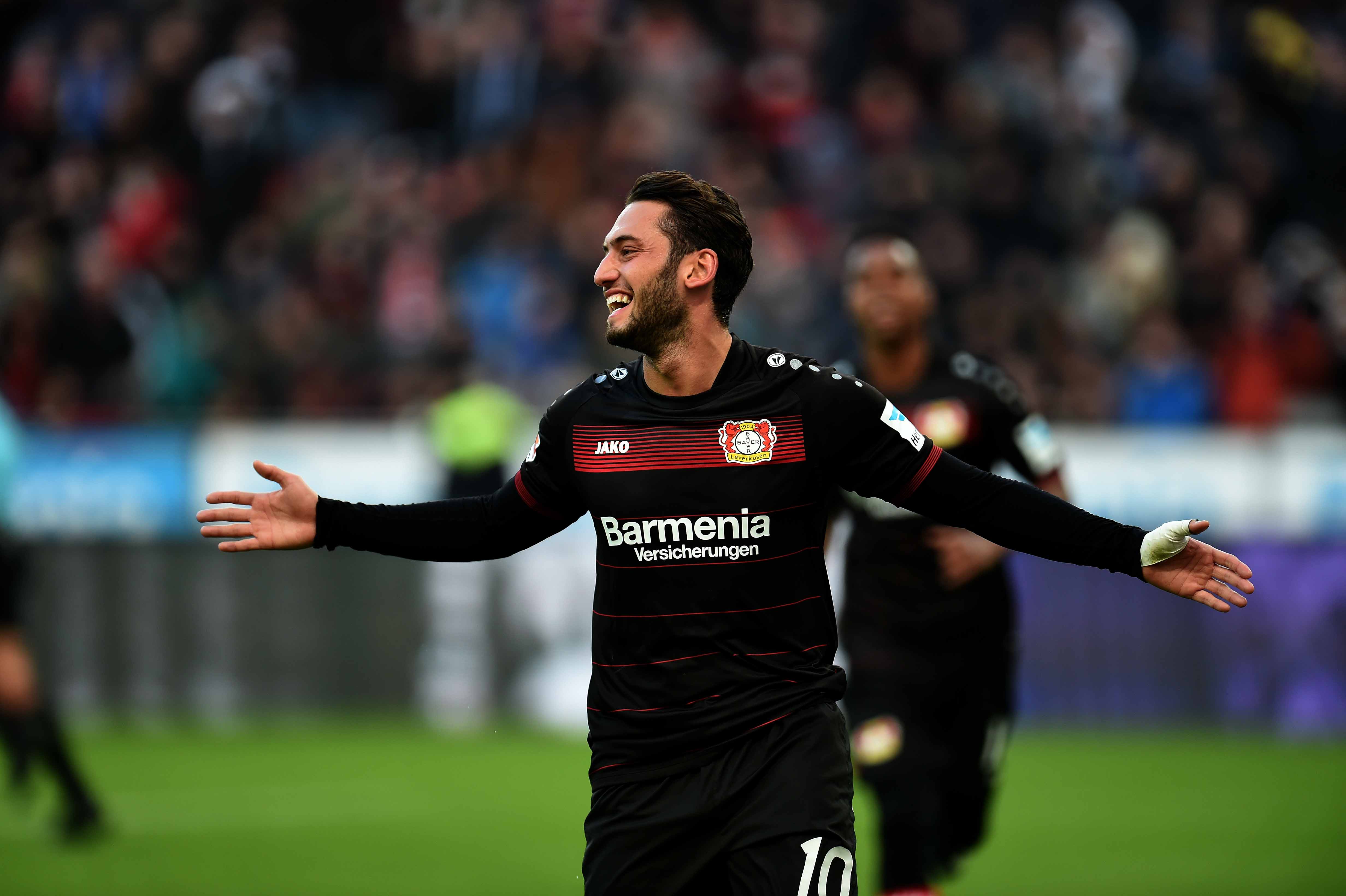 Leverkusen's midfielder Hakan Calhanoglu celebrates during the German first division Bundesliga football match of Bayer Leverkusen vs Hertha BSC Berlin in Leverkusen, western Germany, on January 22, 2017. / AFP / PATRIK STOLLARZ / RESTRICTIONS: DURING MATCH TIME: DFL RULES TO LIMIT THE ONLINE USAGE TO 15 PICTURES PER MATCH AND FORBID IMAGE SEQUENCES TO SIMULATE VIDEO. == RESTRICTED TO EDITORIAL USE == FOR FURTHER QUERIES PLEASE CONTACT DFL DIRECTLY AT + 49 69 650050
        (Photo credit should read PATRIK STOLLARZ/AFP/Getty Images)