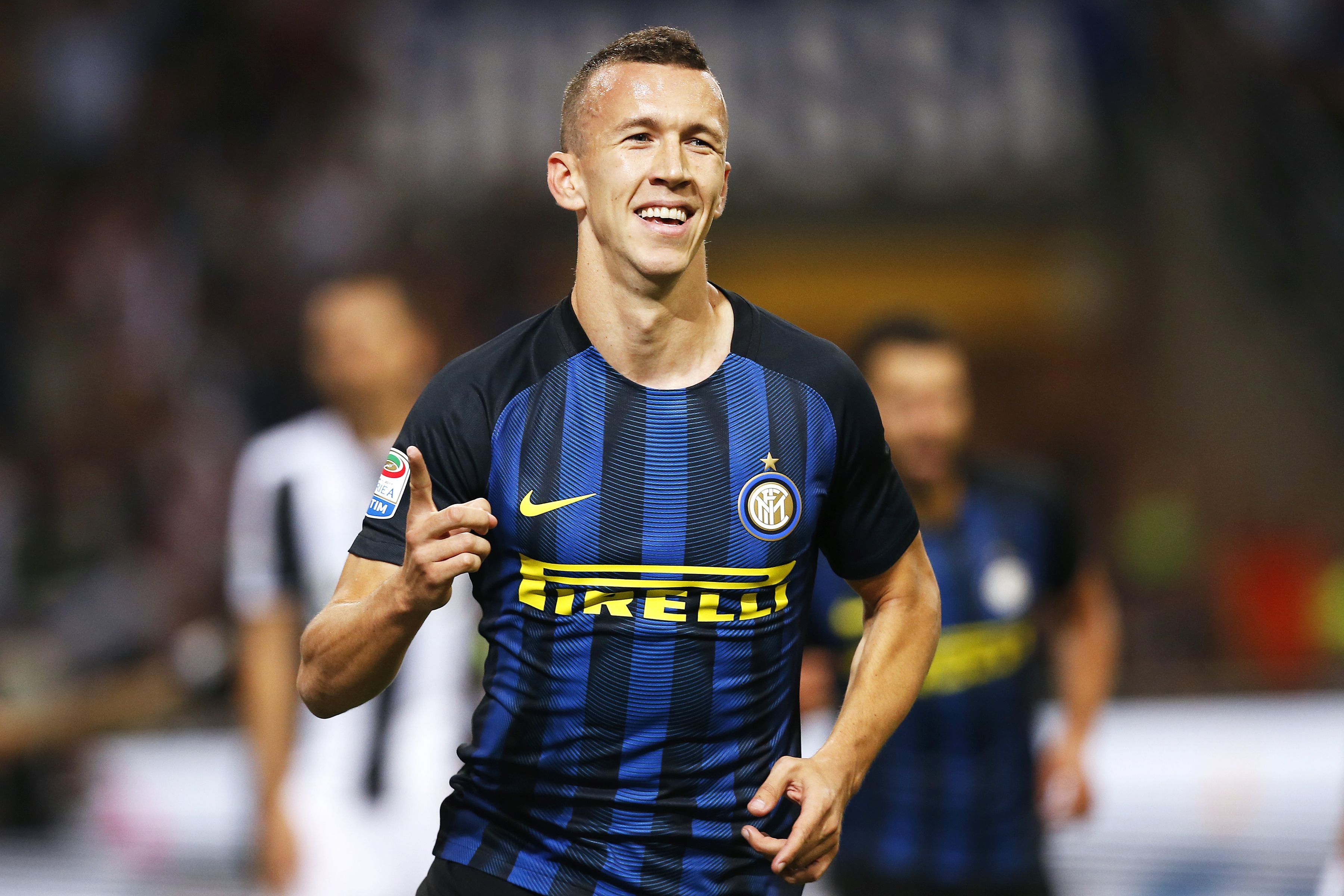 Inter Milan's forward Ivan Perisic from Croatia celebrates after scoring during the Italian Serie A football match Inter Milan vs Juventus on September 18, 2016 at the 'San Siro Stadium' in Milan. / AFP / MARCO BERTORELLO        (Photo credit should read MARCO BERTORELLO/AFP/Getty Images)