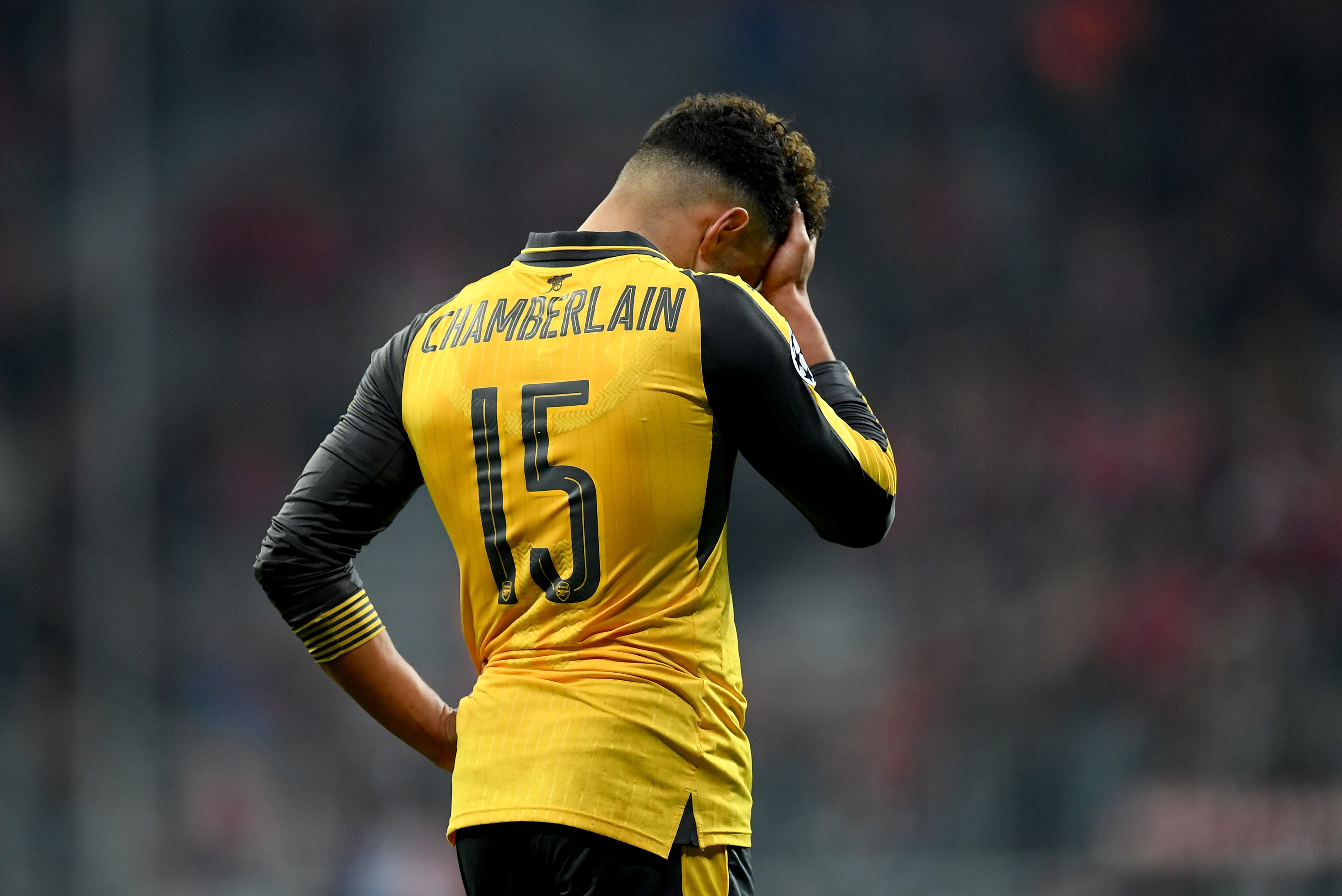 MUNICH, GERMANY - FEBRUARY 15: Alex Oxlade Chamberlain of Arsenal looks dejected after the UEFA Champions League Round of 16 first leg match between FC Bayern Muenchen and Arsenal FC at Allianz Arena on February 15, 2017 in Munich, Germany.  (Photo by Matthias Hangst/Bongarts/Getty Images)