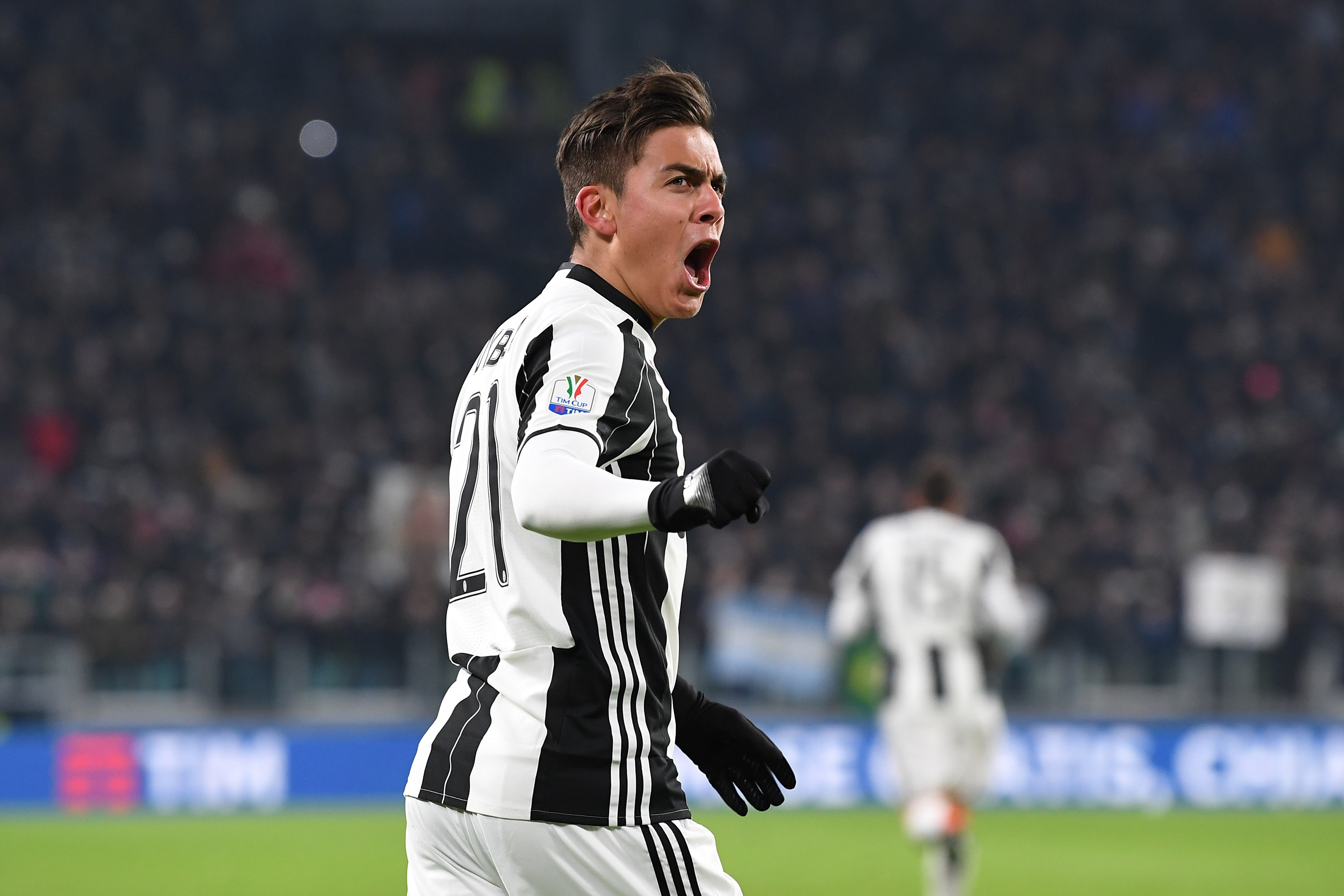 TURIN, ITALY - JANUARY 25:  Paulo Dybala of Juventus FC celebrates after scoring the opening goal during the TIM Cup match between Juventus FC and AC Milan at Juventus Stadium on January 25, 2017 in Turin, Italy.  (Photo by Valerio Pennicino/Getty Images)